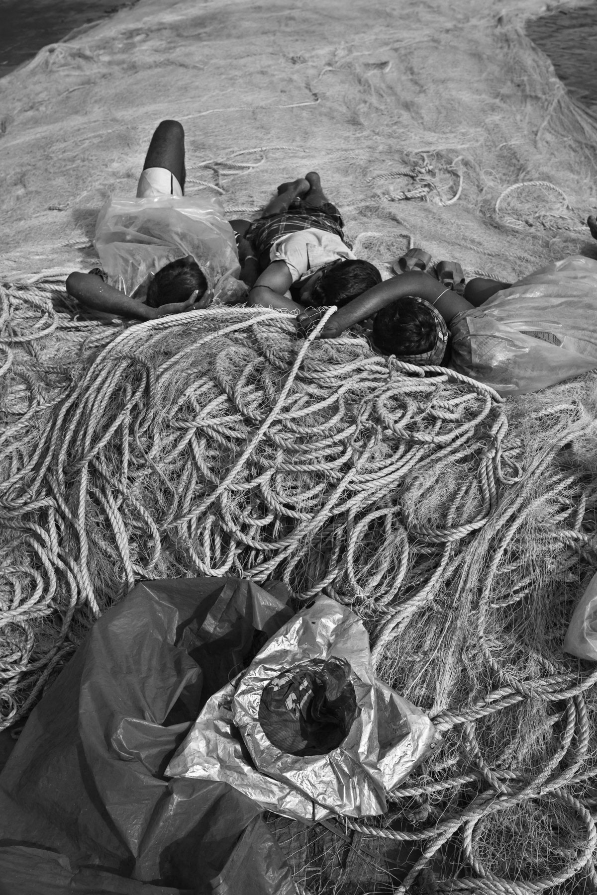 Fish porters after unloading the fishing boats, Sadarghat port in Chittagong, Bangladesh, October 2014