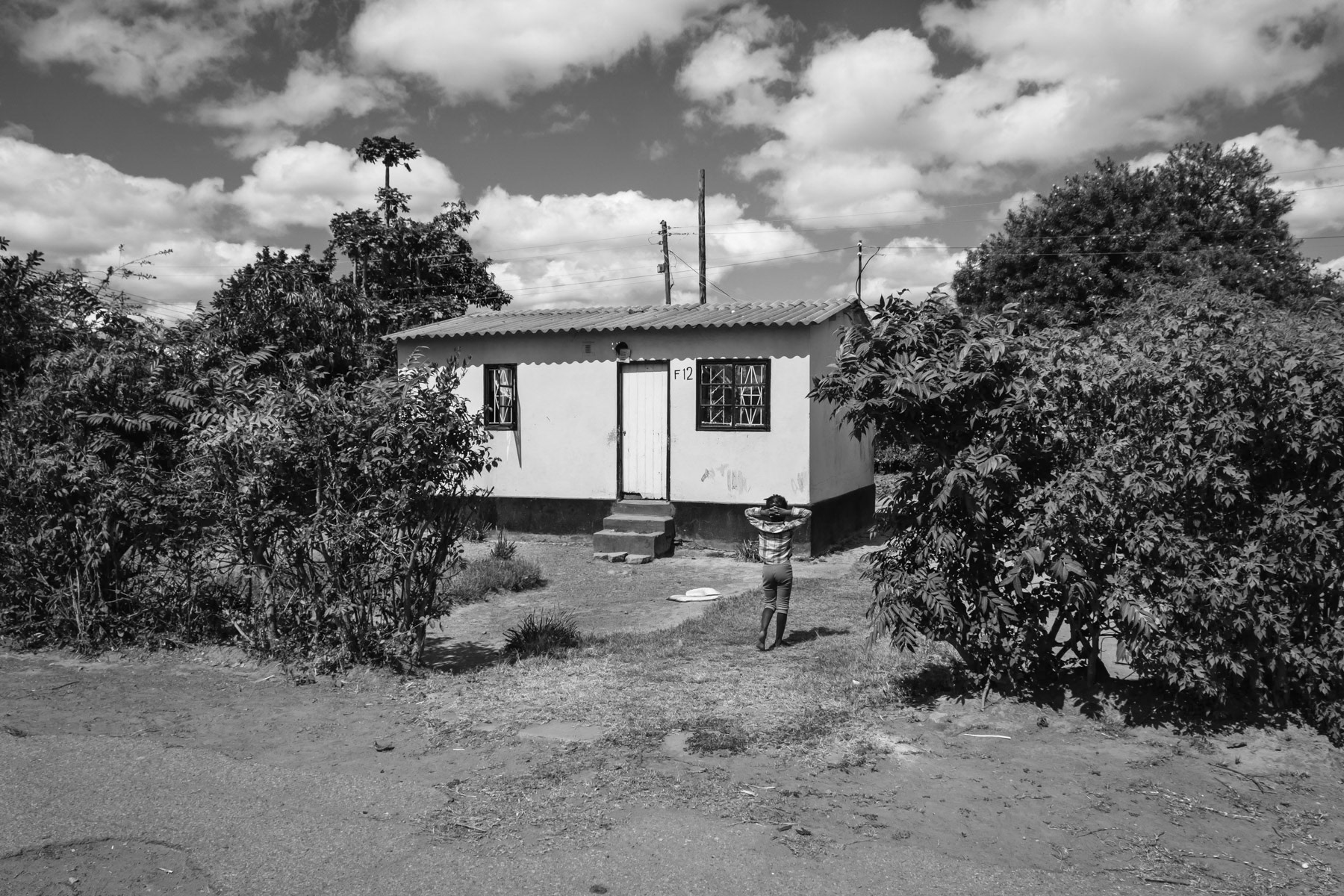 Miner's house in the Kasanda neighbourhood beside the Broken Hill mine. Kasanda is one of the most lead particle contaminated area where people live in the world. Children are specially affected by lead poisening leading to brain, liver and respiratory damage and in the worst cases to premature death. Kasanda district in Kabwe, Zambia, May 2021