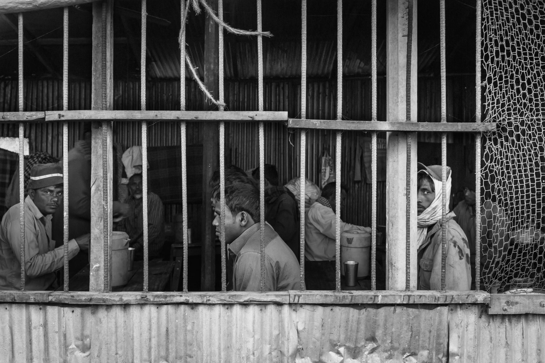 Shipbreaking yards workers before starting the day dismantling ships, tea shop in Bhatiary, Bangladesh, December 2015
