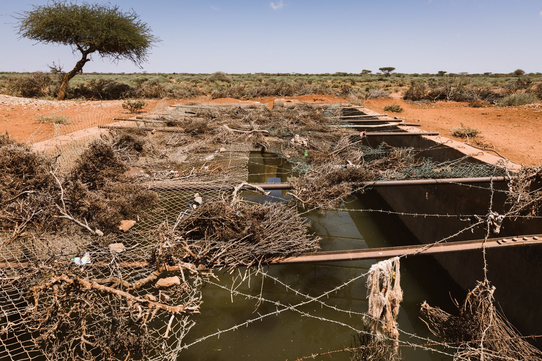 Fenced off water reserve. After 4 years of severe drought, water is the most valuable commodity. Burao Region in Somaliland, Somalia, October 2017