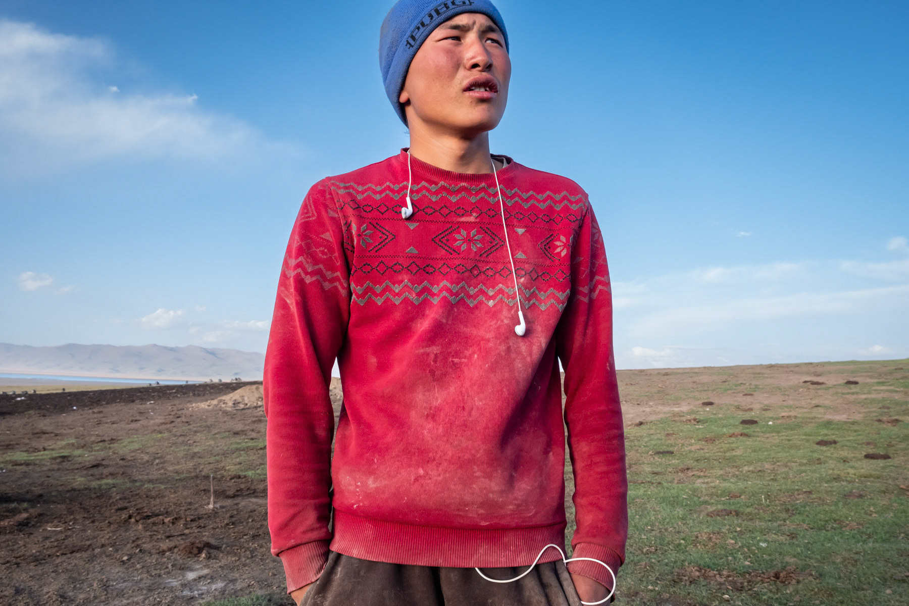 Ramazan, 16 years old, staying with his family during the summer months at high altitude in search of green pastures for their livestock. Livestock is the main subsistance in Kyrgyzstan. Climate change, droughts and soil degradation are affecting their livelihood at unprecedented levels in the past years. Ak Tal, Naryn region, Kyrgyzstan, August 2021