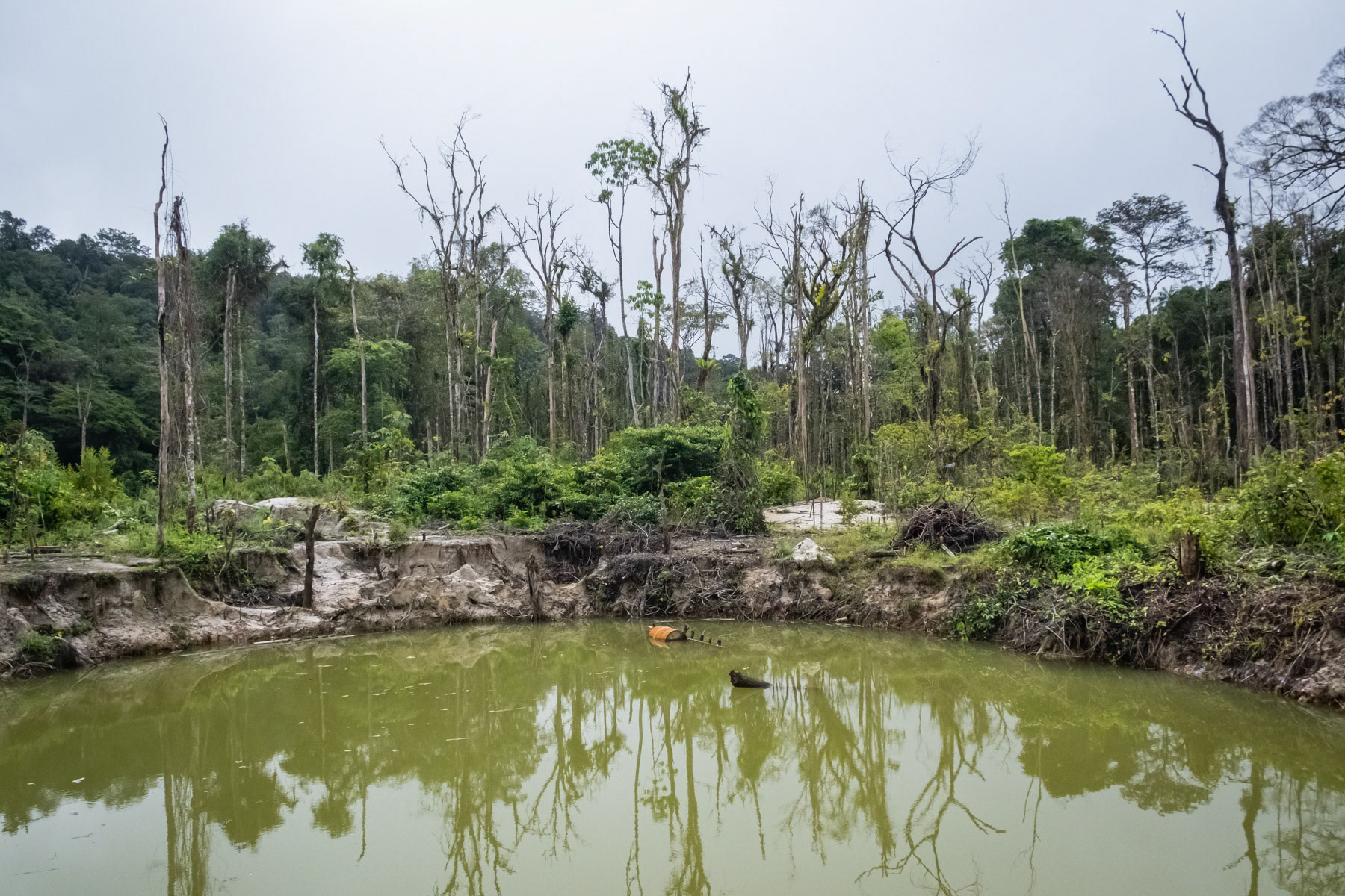 The remains of an illigal goldmine and its devastating consequences on the environment. Amazon rainforest in Sparouine along the Maroni river in French Guyana along the border with Surinam, March 2022