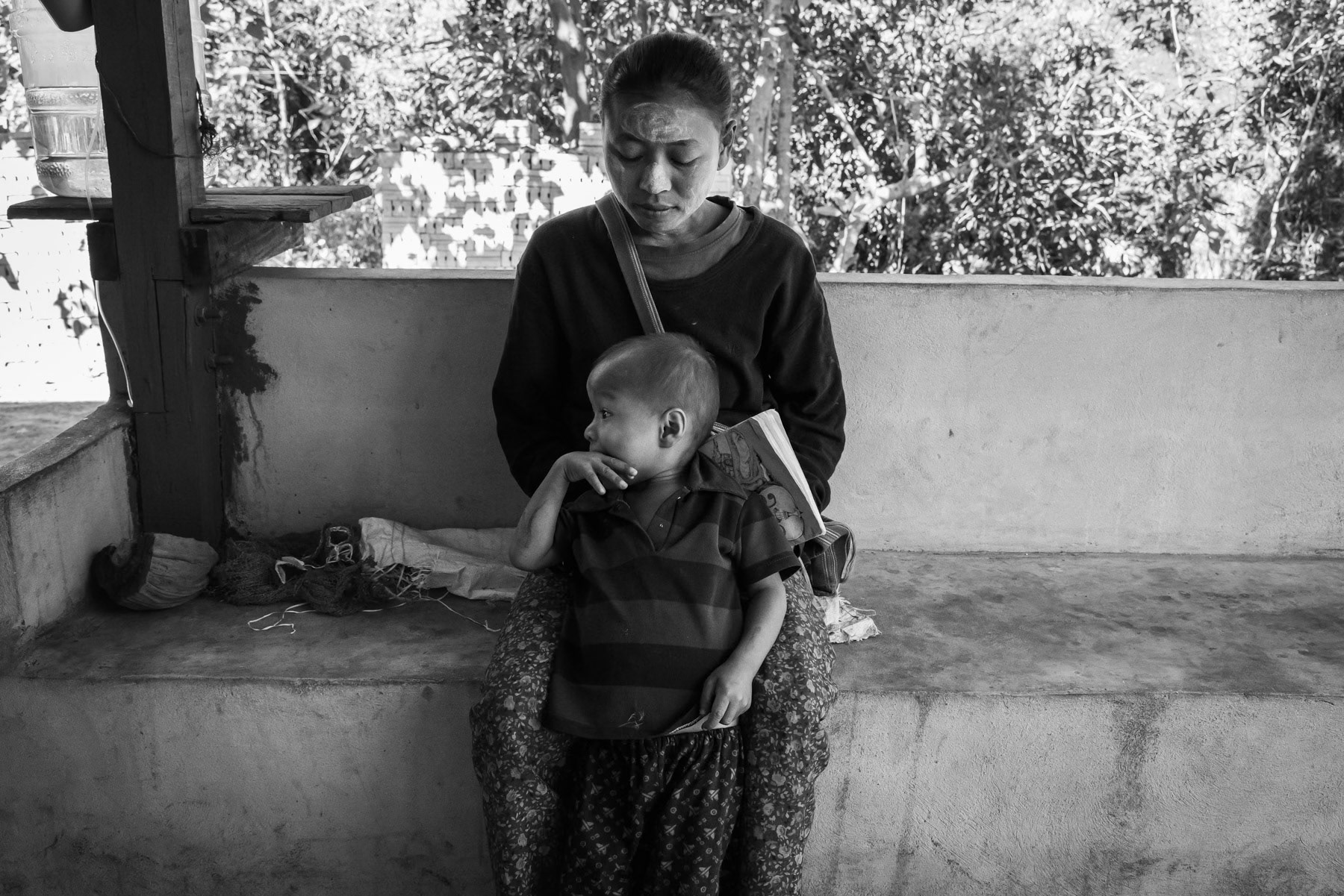 Karen woman and her child. Lae Gho village in Kayin State, Myanmar, January 2024