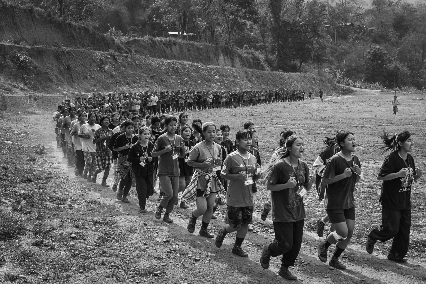 New recruits for the Chin National Army (CNA) doing physical exercises during their lenghty training before integrating the CNA. The ever increasing air strikes and forced military service enacted by the military dictatorship, has substantially increased the number of people that engage and seek refuge with the ethnic armed groups opposing the military coup leaders. CNA HQ, Camp Victoria in Chin State, Myanmar, April 2024