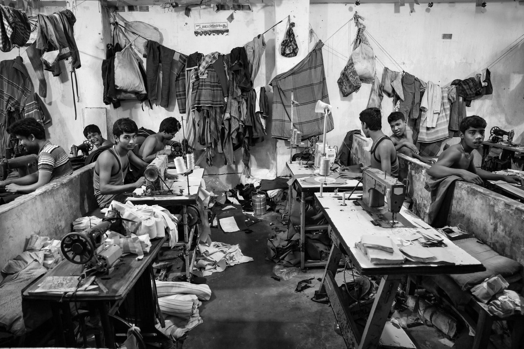 Garment manufacture for the domestic market involves long hour shifts and extremely low salaries. Garment industries that do not export tend to fall out of the control of child labour inspections. Controls that are gradually being put in place in other garment factories and tanneries that exclusively produce clothing for the large international brands. Garment workers, Dhaka, Bangladesh, May 2015
