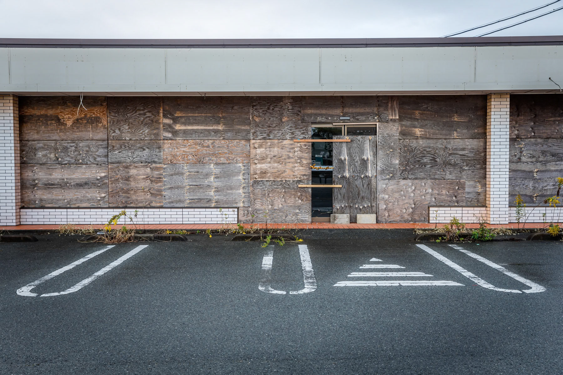 Abandoned building along Route 6 that passes through the most affected and contaminated area around the Daichi nuclear power plant. Namie, Fukushima Prefecture, Japan, October 2019