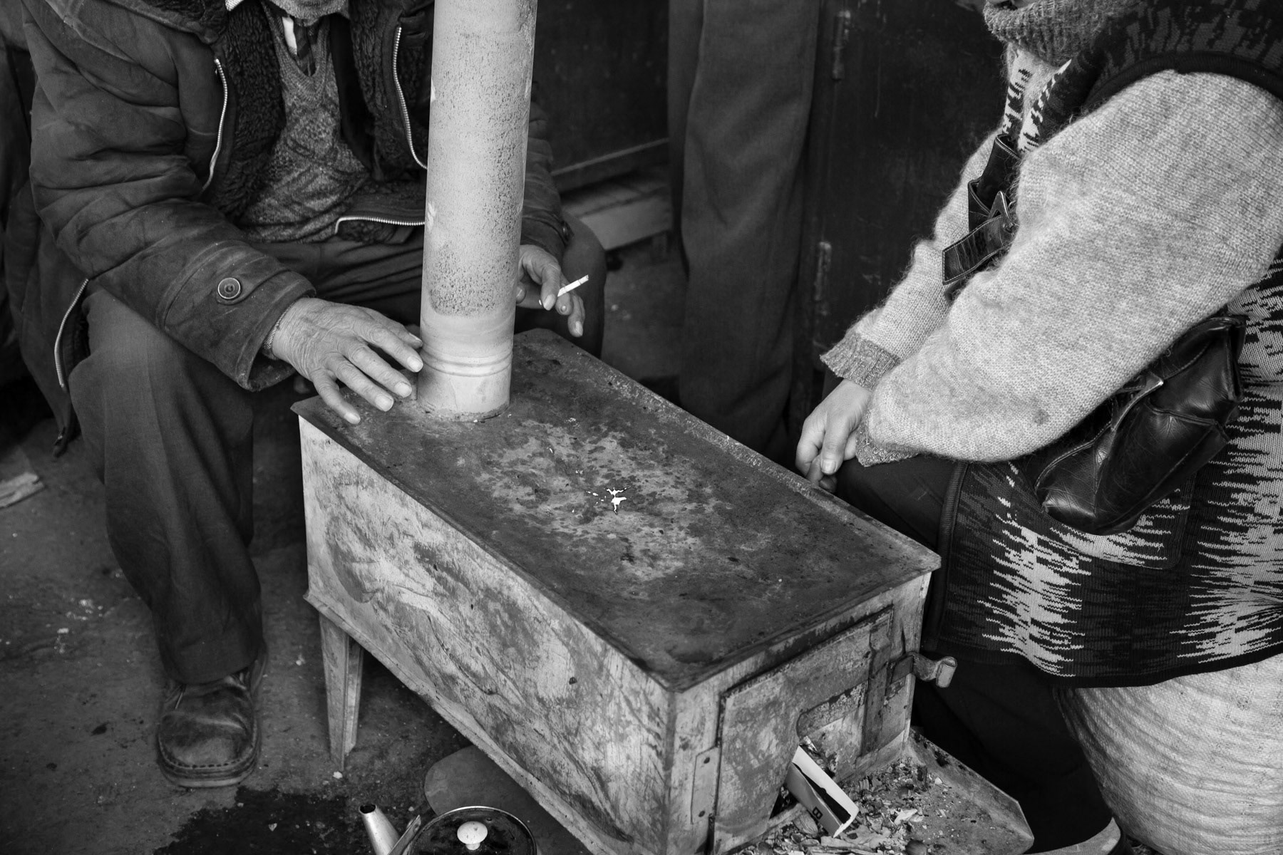 Keeping warm in the morning, market in Stepanakert, Nagorno-Karabakh, February 2014