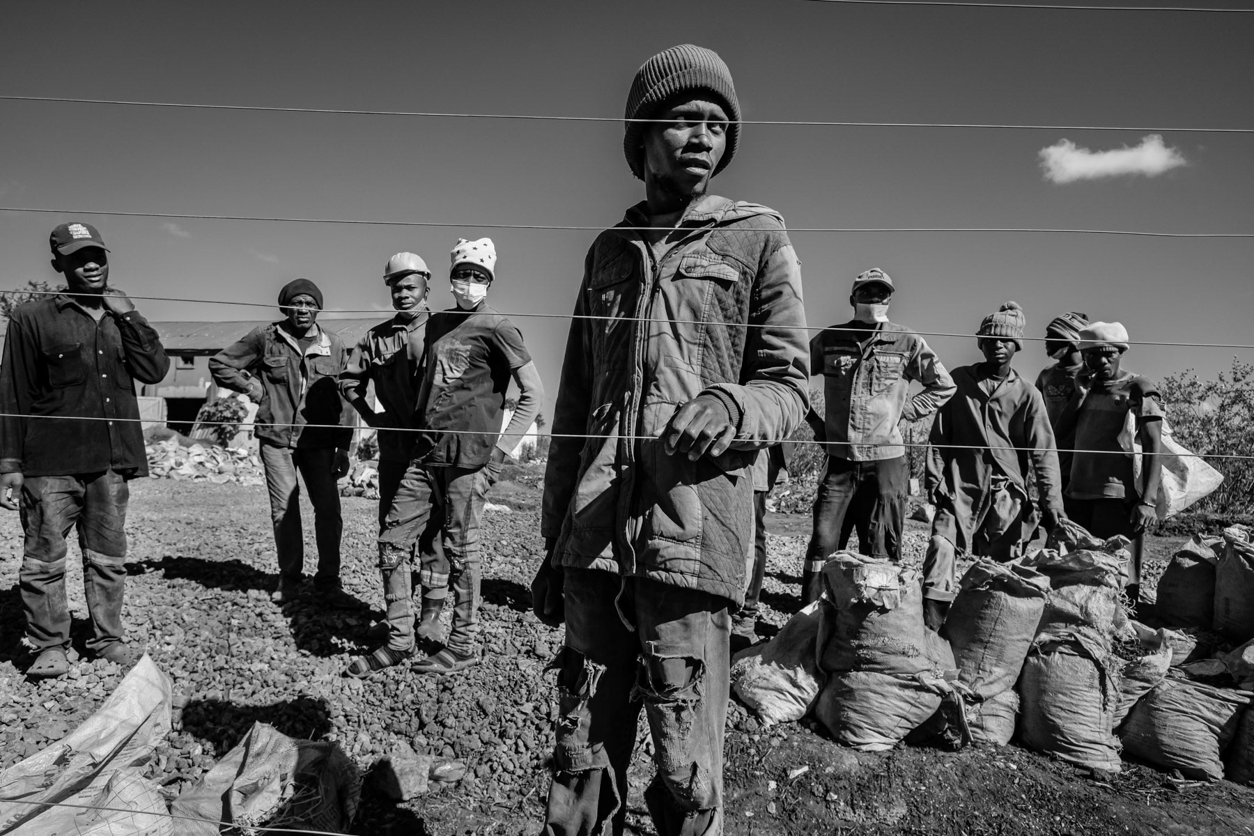 Artisanal/Small scale miners working in lead and zinc open pit mines on the premises of the large "Broken Hill" lead mine that was closed in 1994. Broken Hill mines, Kabwe, Zambia, May 2021