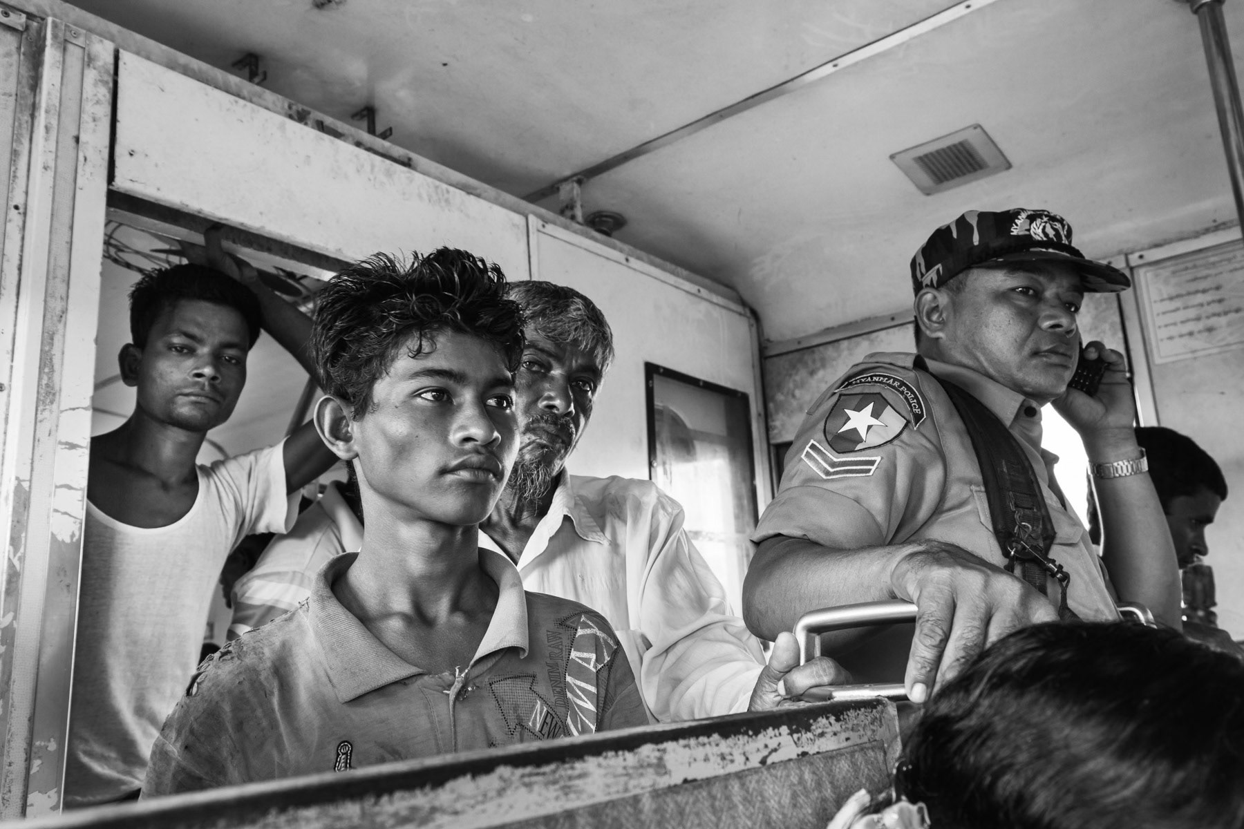 The apartheid train under heavy guard running through the IDP camps outside Sittwe. The train has ceased to operate since the last waves of violence in October 2016 and August 2017. Rakhine State, Myanmar, June 2016