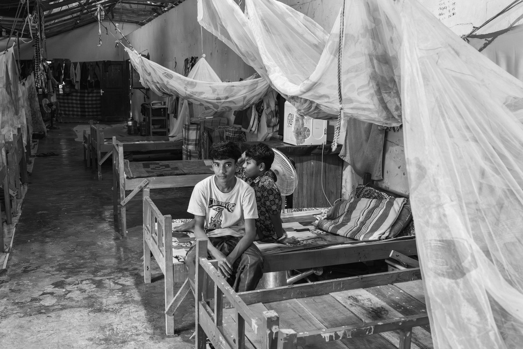 Rohingya stranded in Aceh after having crossed the high seas for several weeks from the southern tip of Bangladesh until reaching Malaysian or Indonesian waters. Achenese communities and Indonesian authorities are the sole country that still accepts them on their shore even though they are kept in shelters of a closed type with very limited freedom of movement. Padang Pijie, Aceh, Sumatra, Indonesia, October 2023