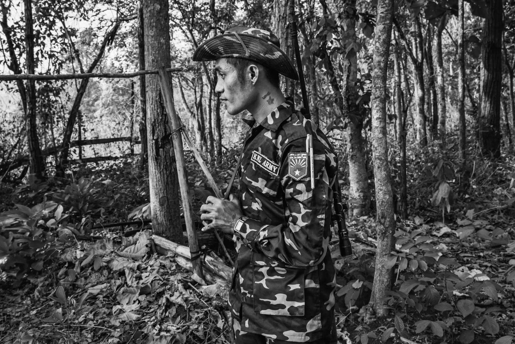 Member of the Karen National Liberation Army (KNLA), the armed resistance to the military dictatorship in an outpost in the forest near Kanele in Kayin State, Myanmar, May 2024