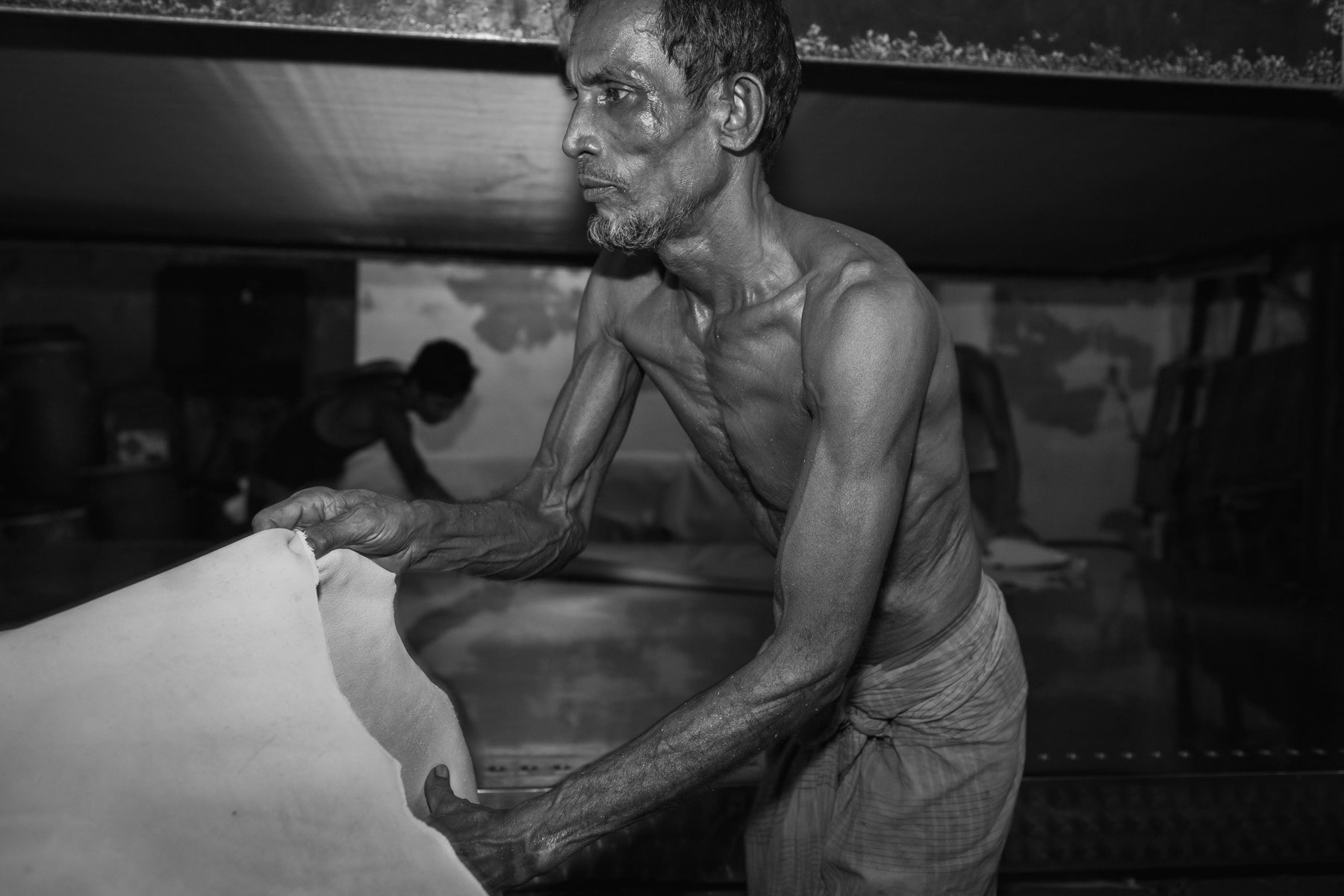 Leather worker, Hazirabagh tannery, Dhaka, Bangladesh, October 2014
