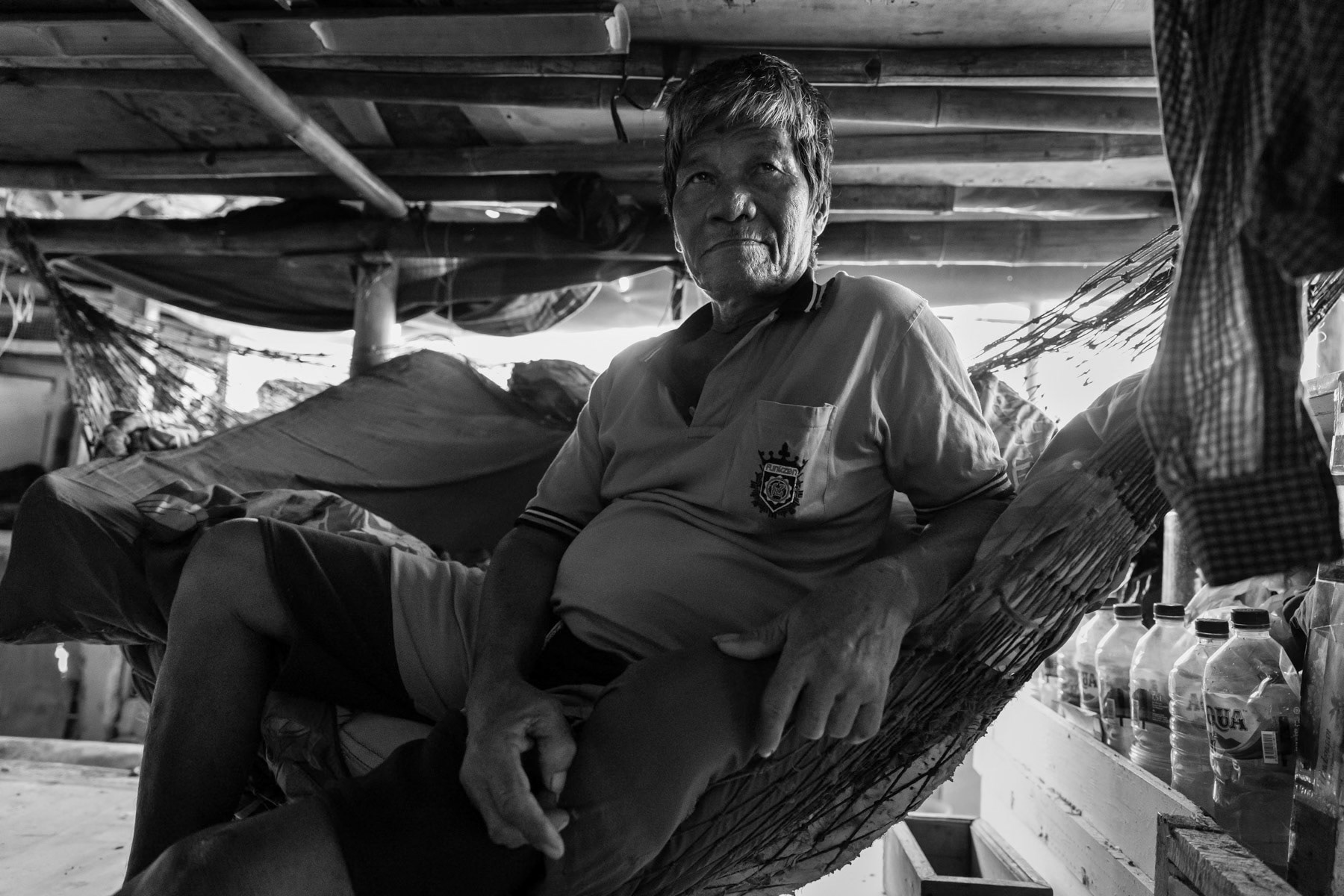 Temporary housing for people evicted from their lands where new infrastructure and real estate projects are being developped. Land rights and land ownership is a big problem affecting mainly poor families from the fishing community. Soil sinking, rising sea levels and floods make their living conditions and survival even more precarious. Muara Angke neighbourhood, North Jakarta, Indonesia, June 2022