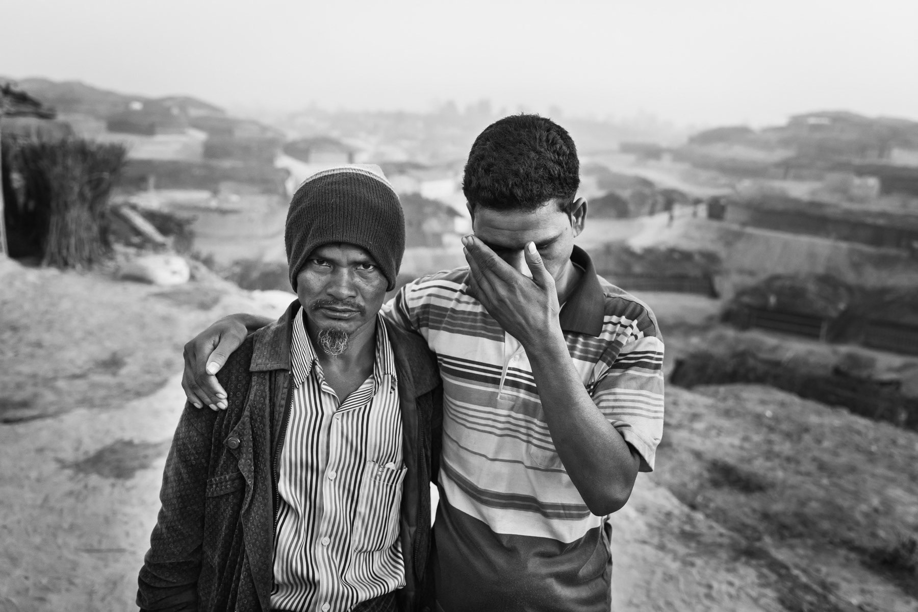 Persecuted Rohingya refugees that have recently arrived in Bangladesh from Myanmar. Two brothers fled together after one was hit by a shrapnel in the head while their village was under attack by the Myanmar military. He became blind as a result of the injury. Kutupalong refugee camp for un-registered new arrivals, Kutupalong, Bangladesh, February 2017