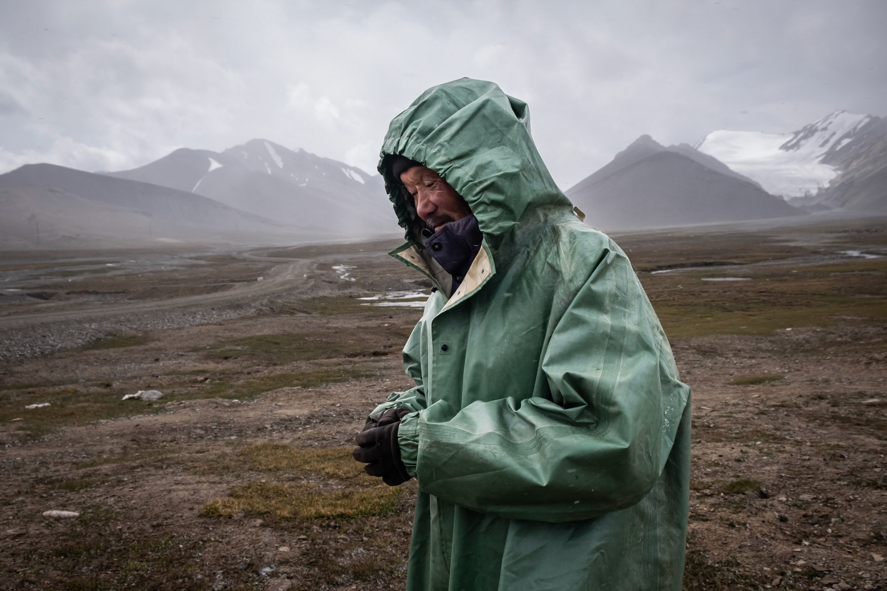 Asambek, 60 years, has been a shepherd since his youngest age. Stays nearly 3 months at an altitude of 4,000m with his herd of 750 sheeps and his younger brother to help him. At this altitude only sheep and yak can survive. He has been coming here for the past 8 years because few people come and he can find more water and grass. Before he would never go much higher than 3,000m but during the past years, grass and water have become scarce at lower altitude and in the valleys due to the recurrent drought and soil degradation. As a shepherd he is also the first in line to witness the melting and disappearance of the glaciers. Arabel, Issyk Kul region, Kyrgyzstan, August 2021
