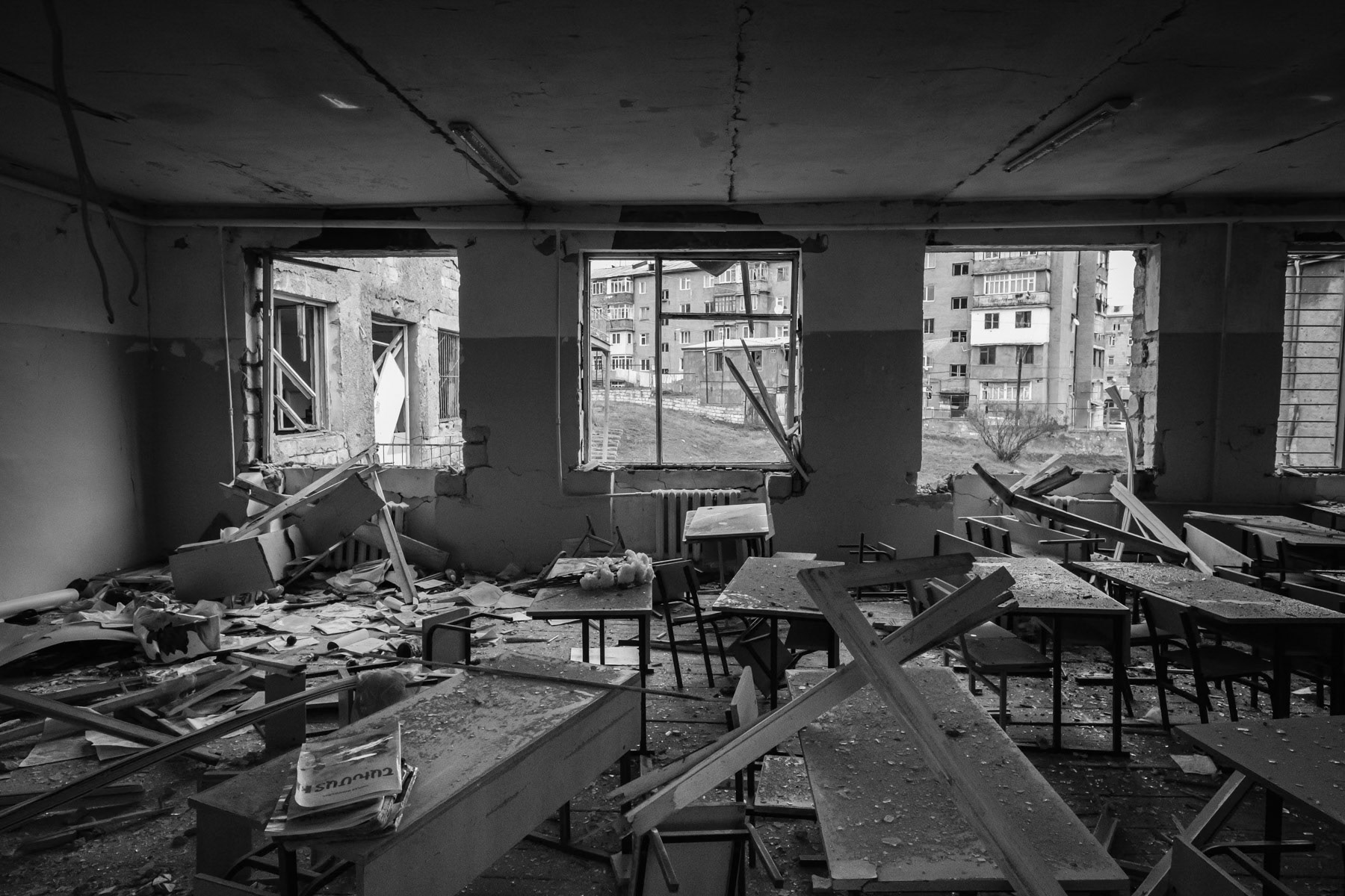 School Nr 10 after repeated Azerbaijani artillery hits. Starting on the 27th of September 2020, the Azerbaijani artillery and drones kept Stepanakert, the capital of Nagorno-Karabakh, a town with a population of 50,000, under fire for 44 days. Human Rights reports highlighted the use by both sides of banned munitions such as cluster munitions and artillery rockets that did not distinguish between military targets and civilian structures. Armenian forces have also hit several times densely populated areas with rockets within Azerbaijan and in particular Ganja, the second largest city of the country. Secondary school 10 in Stepanakert, Nagorno-Karabakh, December 2020