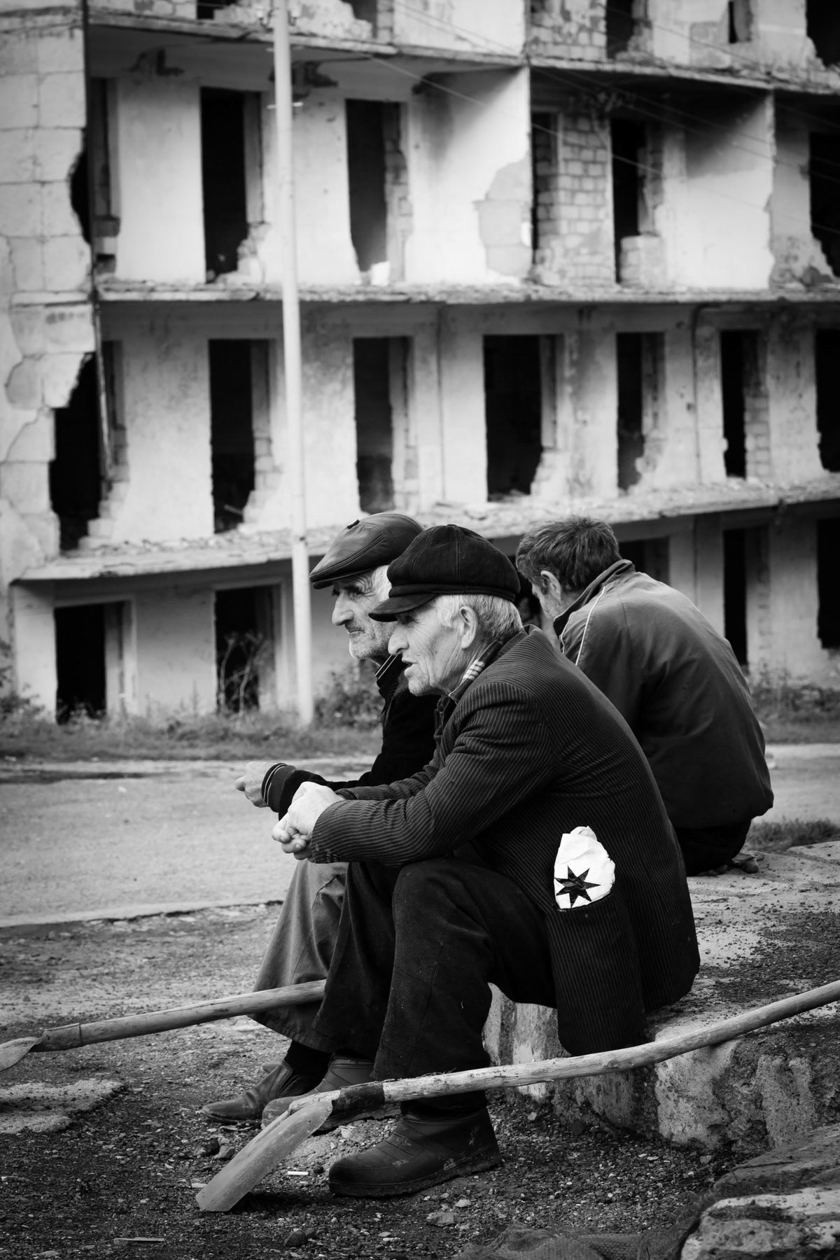 Road maintenance workers in Shushi where large parts of the city were destroyed during the war in the early nineties. Reconstruction is ongoing twenty years later at a slow pace, Nagorno-Karabakh, October 2013