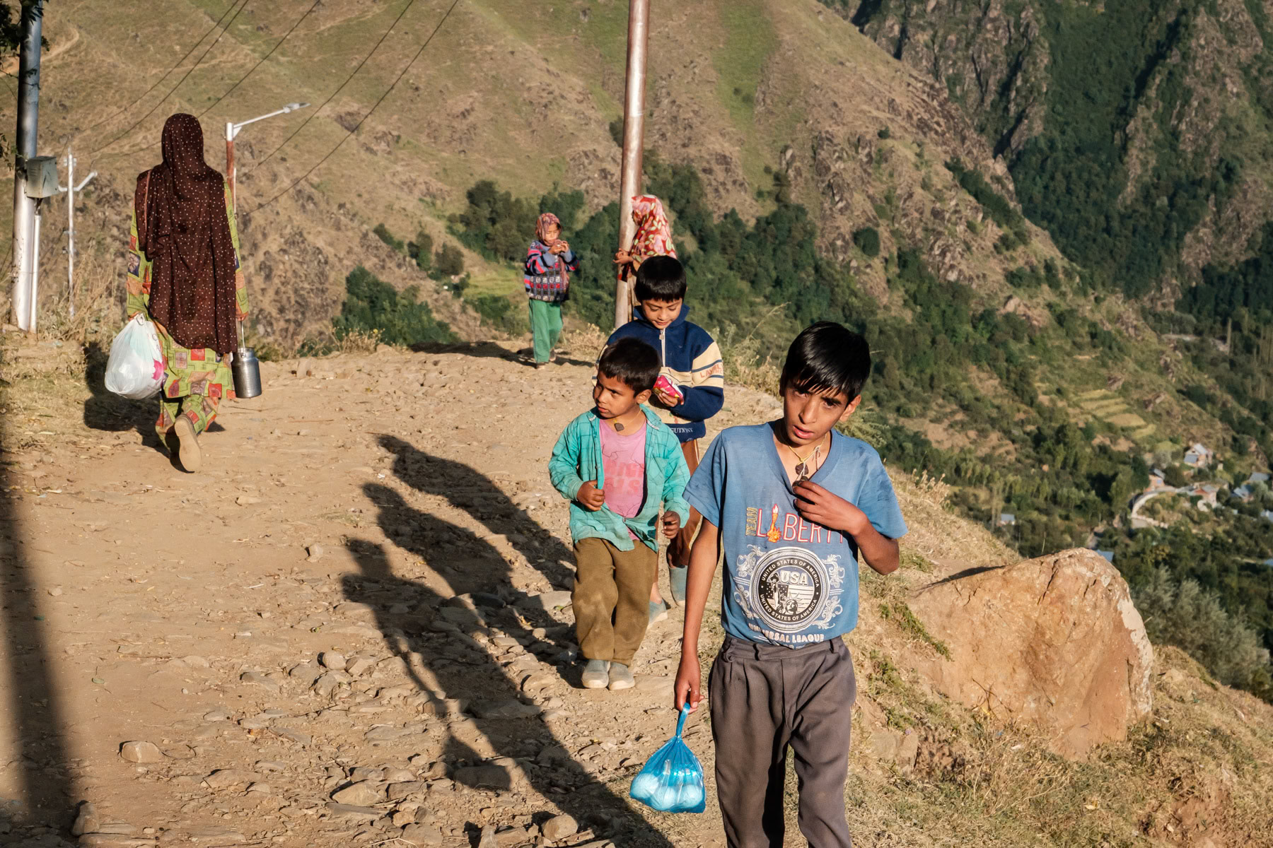 Children of the Gujjar semi nomadic community in their high altitude summer village where they bring their live stock to graze. Faqir Gujri village in Indian Administrated Kashmir, September 2023