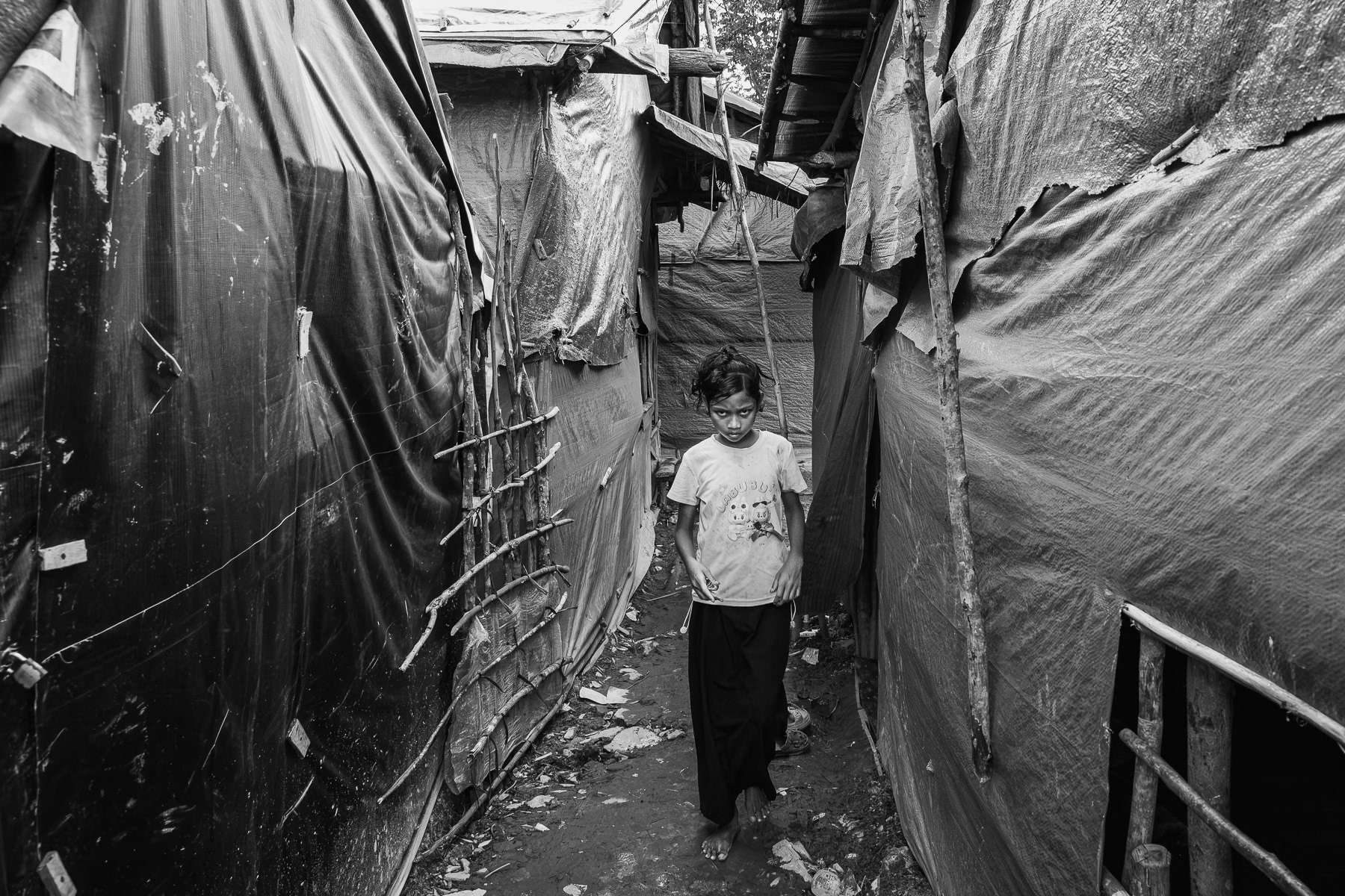 Months after a perilous boat journey, a Rohingya refugee finds a fragile home in a makeshift camp in Sumatra. Pekanbaru, Indonesia, May 2025