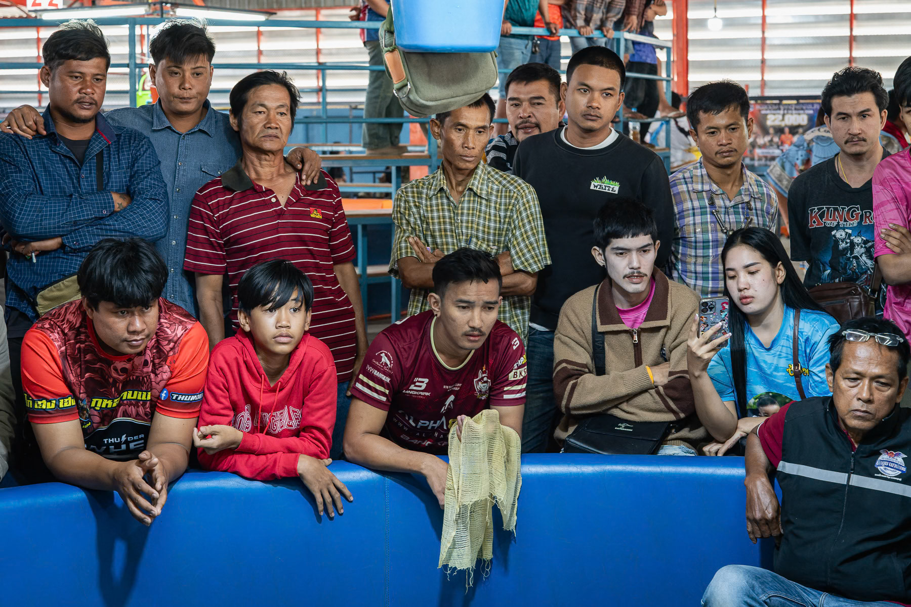Spectators watching a rooster fight. Kanchanaburi, Thailand, January 2025