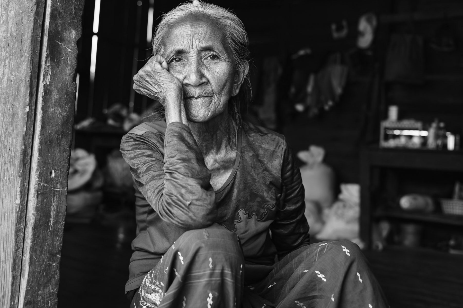 70 years old grandmother of the Thluang Bik family in Saopun village in Thantlang township. Chin State, Myanmar, April 2024
