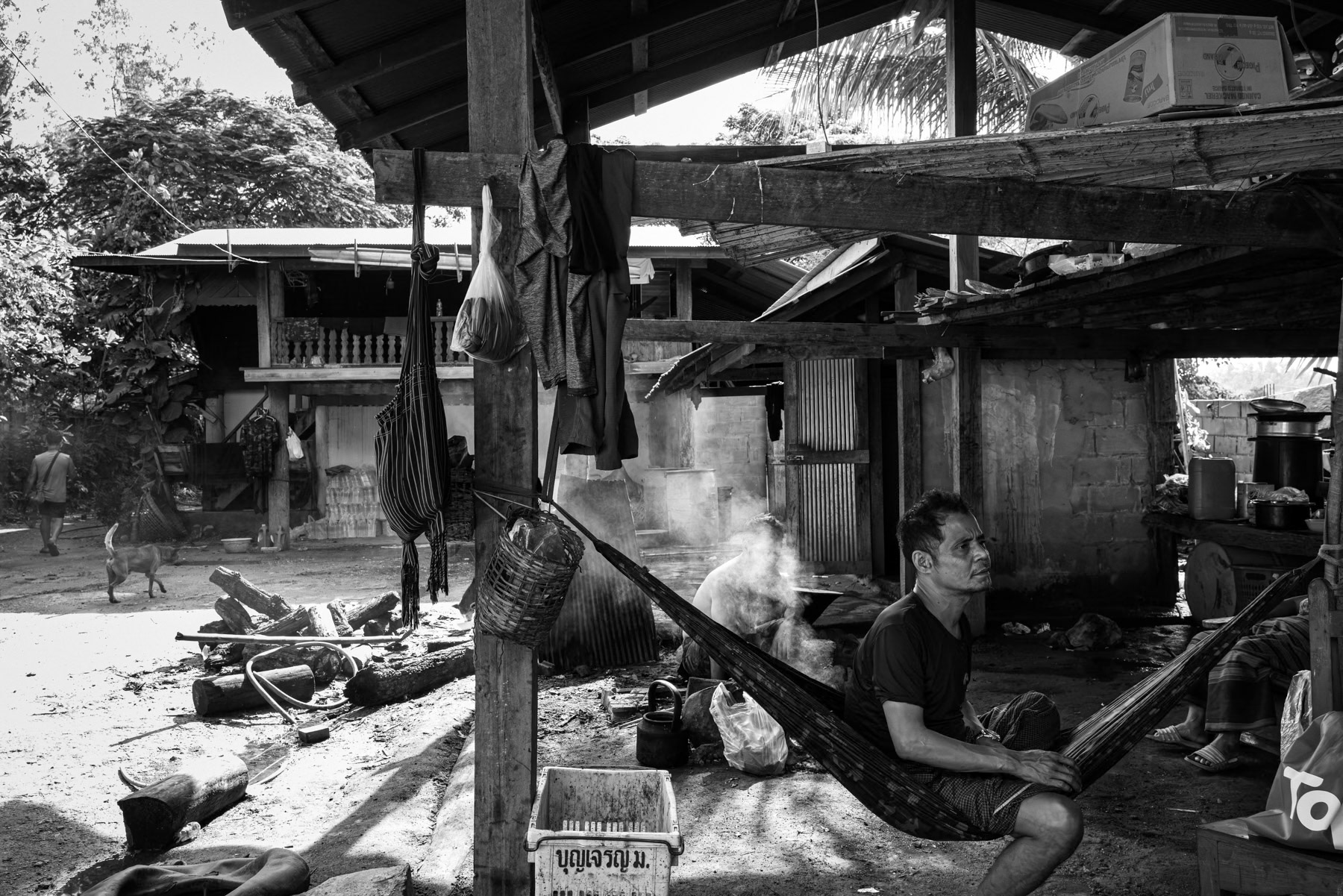 A KNLA soldier rests in a hammock, taking a brief pause from the ongoing conflict in Karen State. Wale, Karen State, Myanmar, October 2025