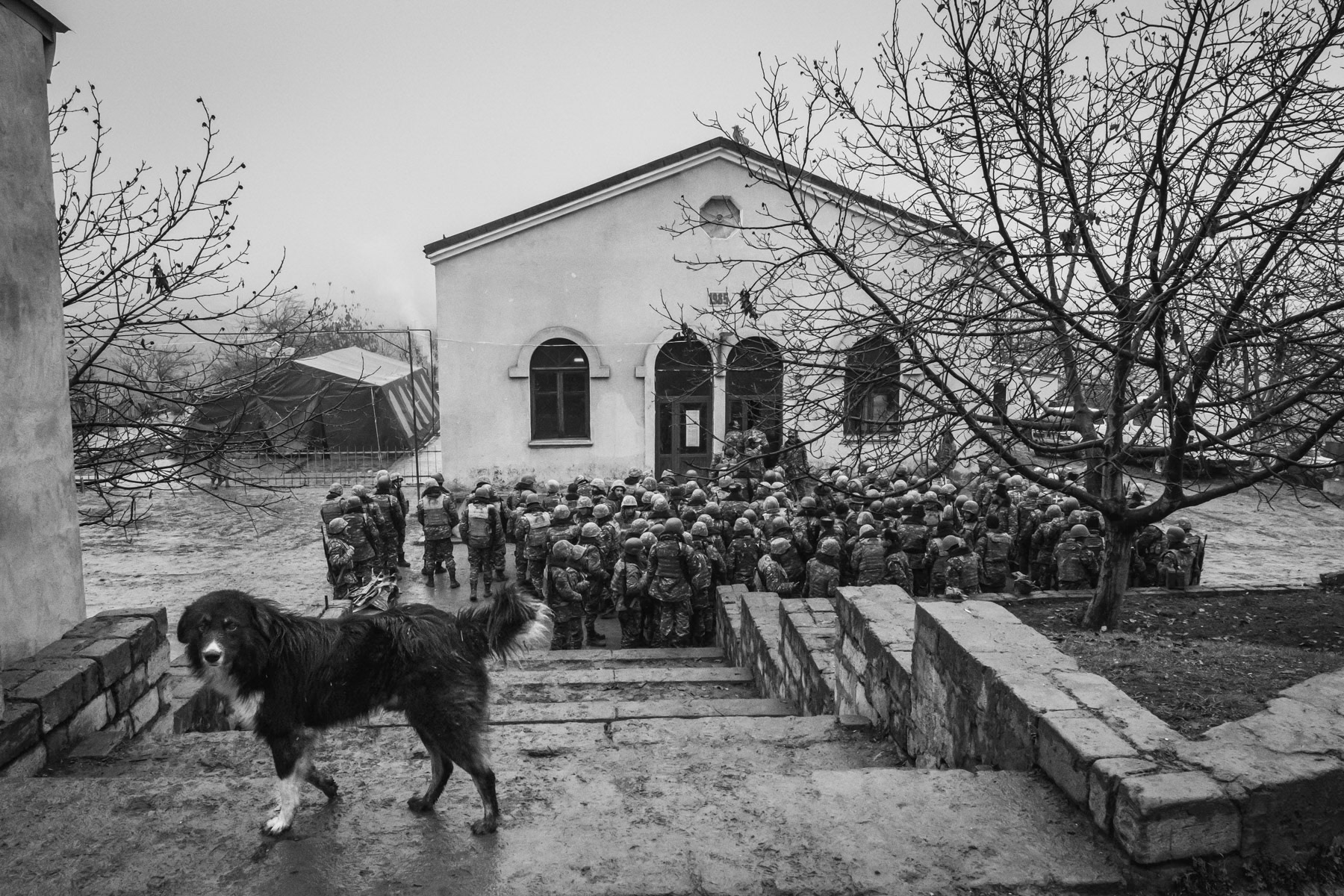 Armenian servicemen receiving their briefing before being dispatched for their guard duty shift along the new frontlines nearby. Chartar town, Nagorno-Karabakh, December 2020