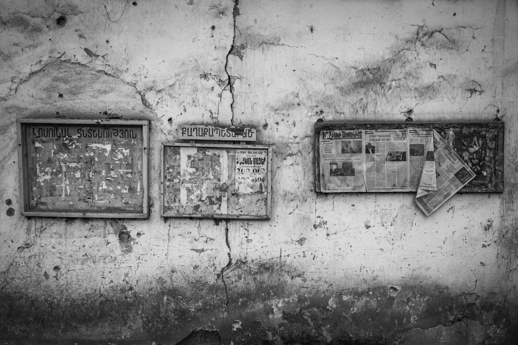 Newspaper and announcement wall. Martuni town, Nagorno-Karabakh, December 2020