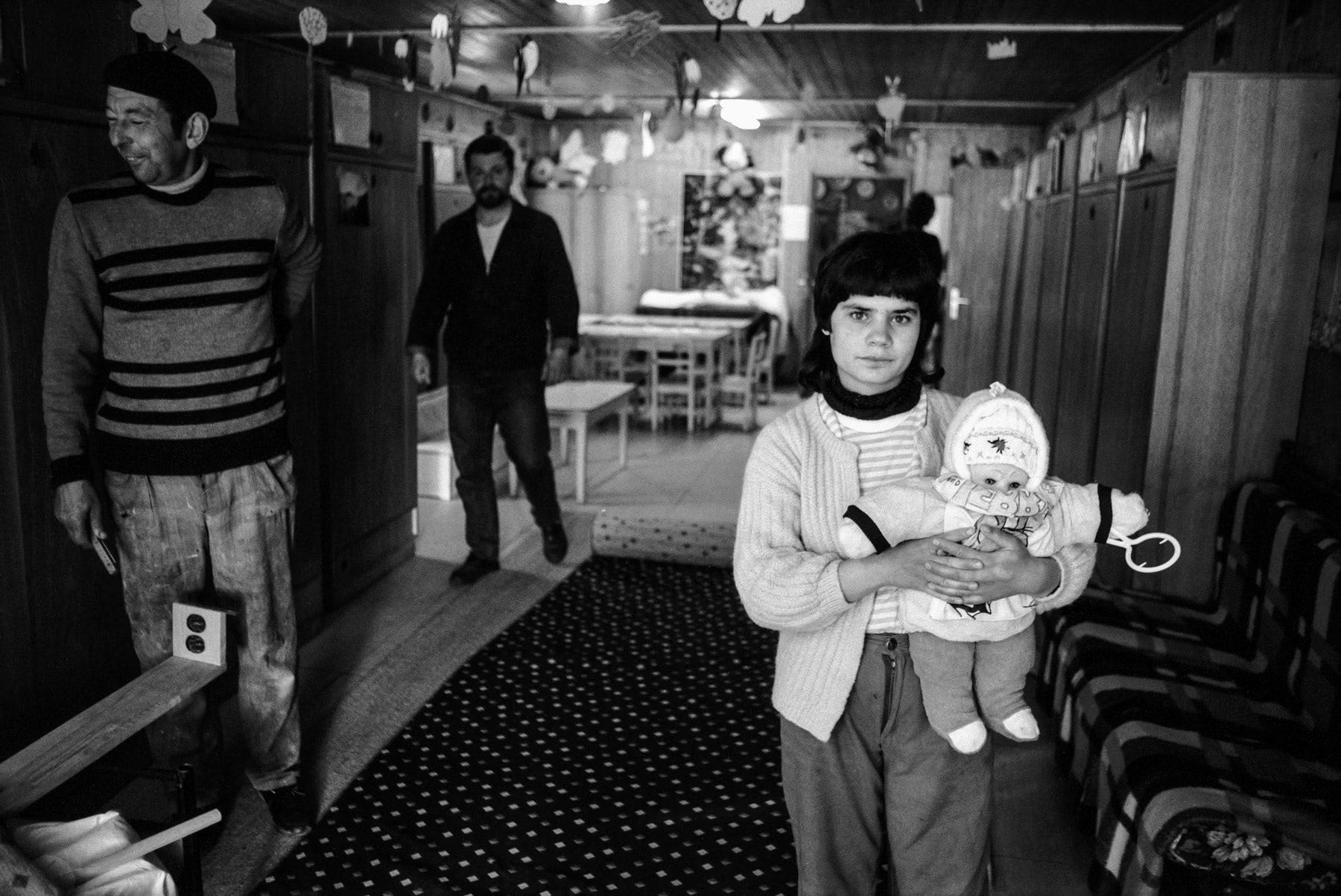 Ceausescu's policies of outlawing abortion and birth control, dictating that every woman bears a minimum of five children, had created a generation of children that were cared for by the state. This resulted in large numbers of orphans, in most cases abandoned by their parents, being incarcerated in child insitutions accross Romania. Only after the fall of Ceausescu, international organisations could provide assistance and support reform or closure of such institutions. This series of photographs was taken in 1993 for Médecins Sans Frontières in the framework of an awareness campaign. Orphans, Cluj-Napoca in Romania, May 1993
