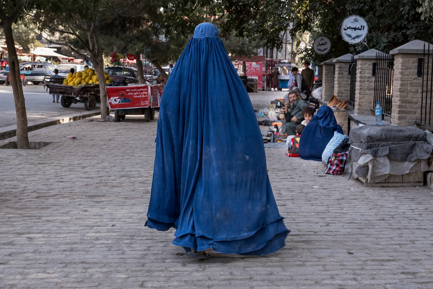 An Afghan woman wearing the 'Chaador' navigating the streets of Balkh. Since the Taliban take over of the country, endless restrictions have been placed on women, banning them from education, work, cultural activities and basically the streets where they should be accompagnied by a male guardian. Afghanistan under the Taliban has become a 'no woman's land' and a gender apartheid system. Balkh city, Afghanistan, September 2024