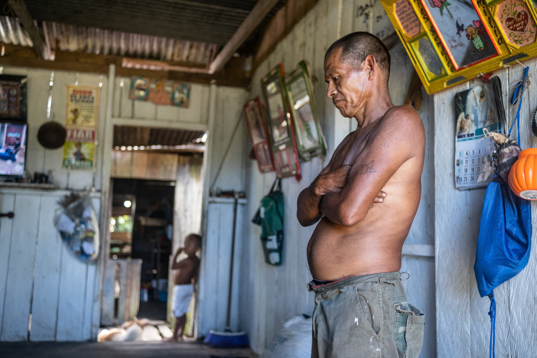 Señor Idalino in his home. He is the indigenous community leader of San Teresita, a remote village in the Amazonian district of Puerto Nariño in Southern Colombia, April 2022
