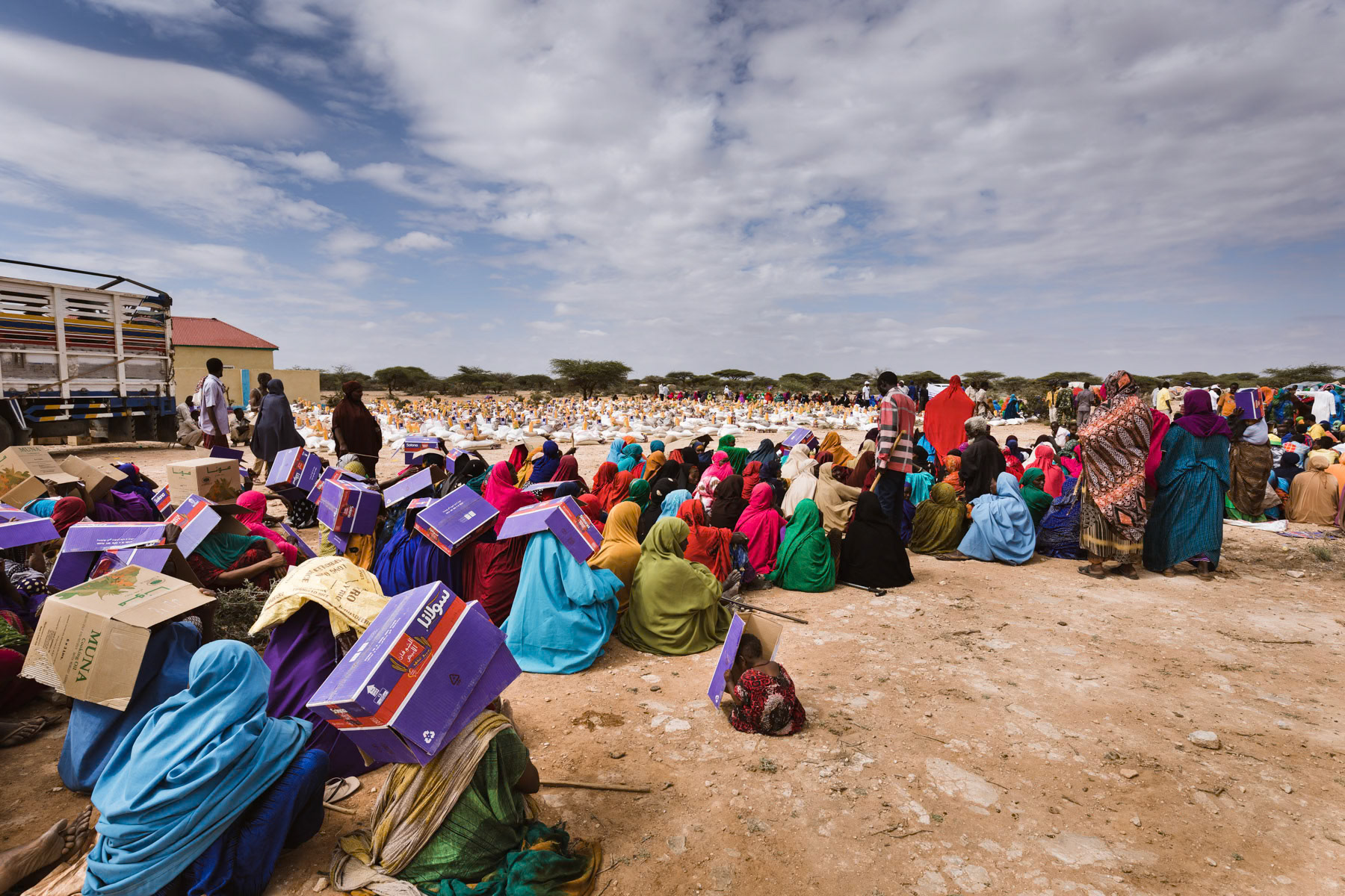 Climate refugees that lost all their livestock to the drought, waiting to get their 2 weekly food distribution. Wadamago IDP camp, Aynabo district of Saraar region in Somaliland, October 2017