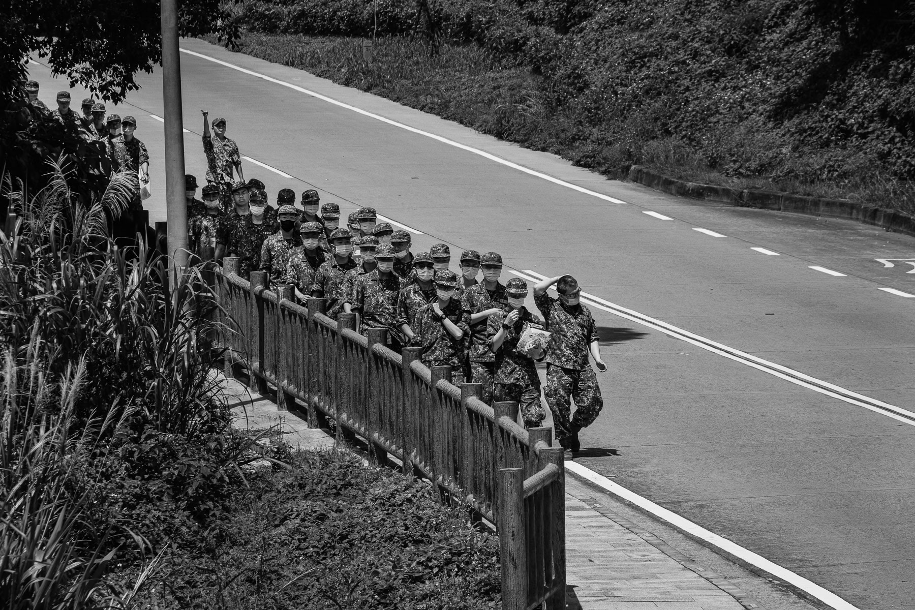 On the heavily militarized Matsu Islands, troops march a familiar path to their base. Nangan, Taiwan, May 2025