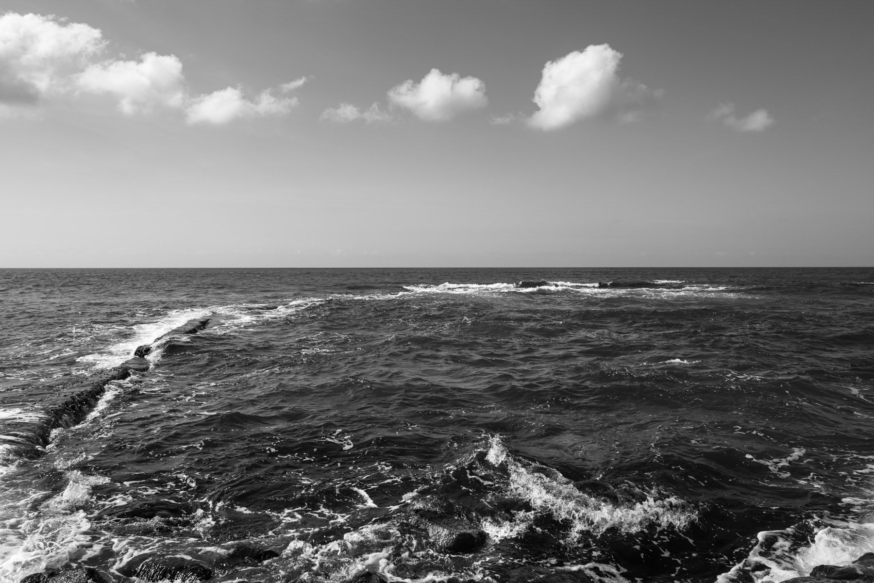 A natural basin used to catch fish during low tide along the coast of Penghu island, Taiwan, October 2025