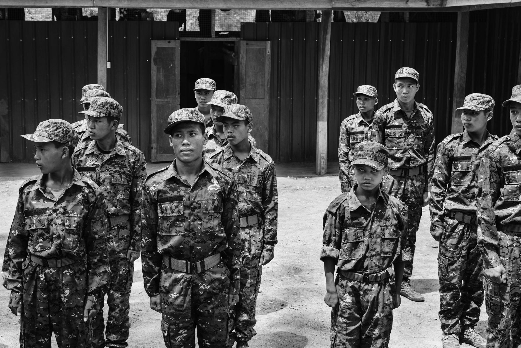 CNA new recruits undergoing military training. The recruits under 18, often orphans, will after their training be assigned to non-combat function within the HQ and continue learning a specialisation until the age of 18. Chin National Army HQ, Chinlung in Chin State, Myanmar, April 2024
