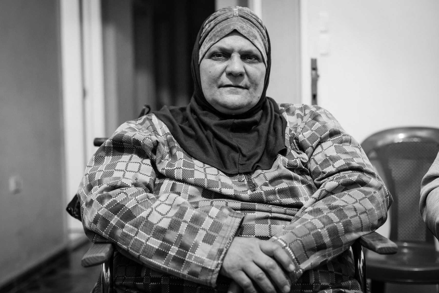 Paralysed woman following war injuries, shelter for disabled syrian civilians, Tripoli, Lebanon, March 2016