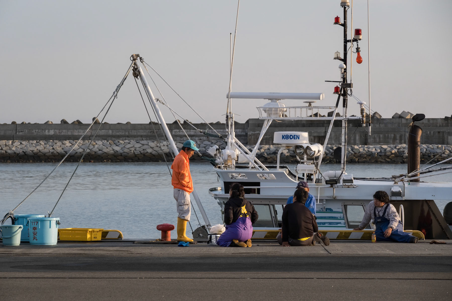 Fishermen beside their boat at the Soma fishing port about 40 Km north of the Fukushima nuclear power plant where treated cooling water is being released in the ocean after the green light of the international agency for nuclear energy. Soma, Fukushima, Japan, October 2023