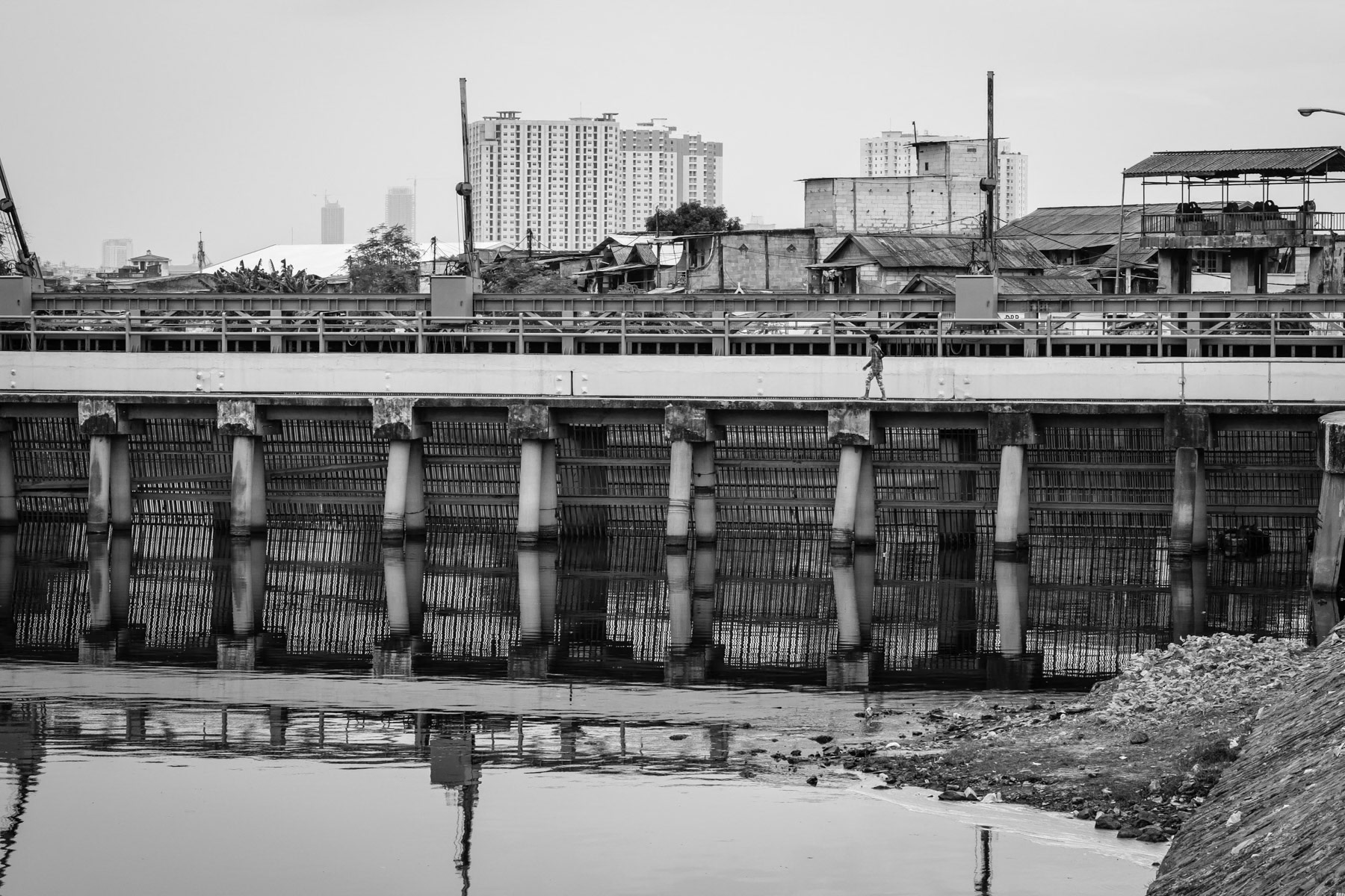 A dam near the pumping station of Waduk Pluit, an artificial lake, regulating in- and outflows between the river and the Bay of Jakarta. Muara Baru, Jakarta, Indonesia, March 2020
