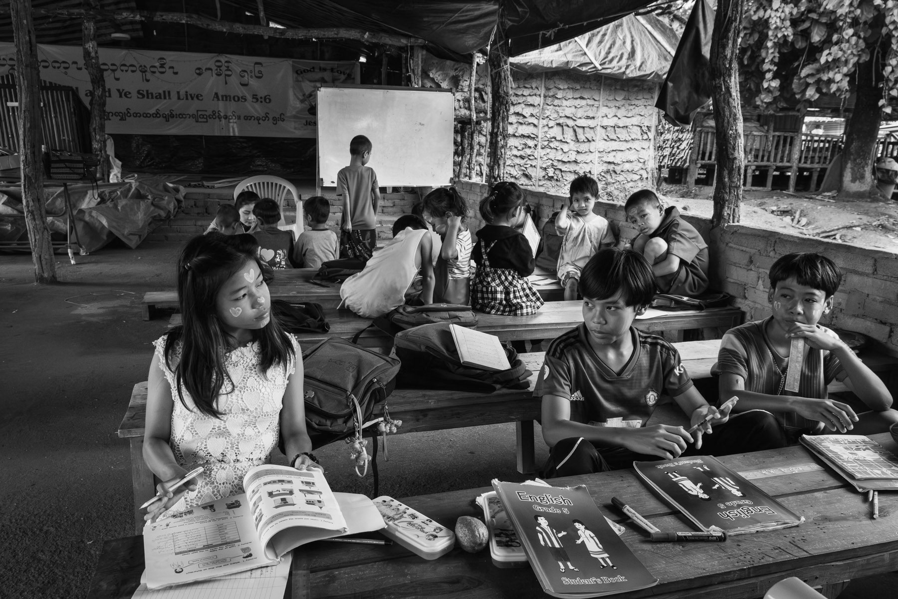 Karen children in a camp school for internal displaced persons (IDP). Ever since the military coup in Myanmar, the intensity of the conflict has dramatically increased in ethnic minority areas and repeated airstrikes on civilian population have uprooted people in the millions throughout the country. Lae Gho IDP camp in a part of Kayin controlled by the Democratic Karen Buddhist Army (DKBA), Myanmar, September 2023