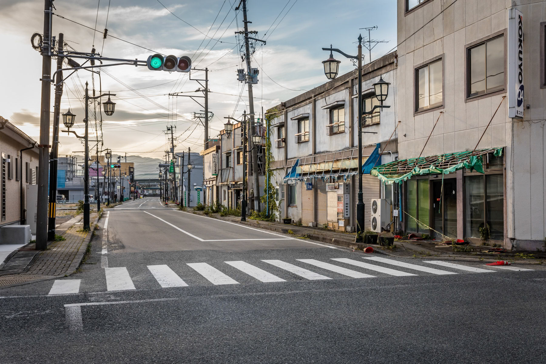 Namie and its ghost town feeling. Before the 2011 Tsunami and the Fukushima Nuclear Power Plant meltdown more than 21,000 people lived in the town of Namie few Km from the power plant. Today, less than 1,000 have returned and most houses and buildings have been earmarked for destruction and removal of contaminated building materials. Fukushima Prefecture, Japan, October 2019