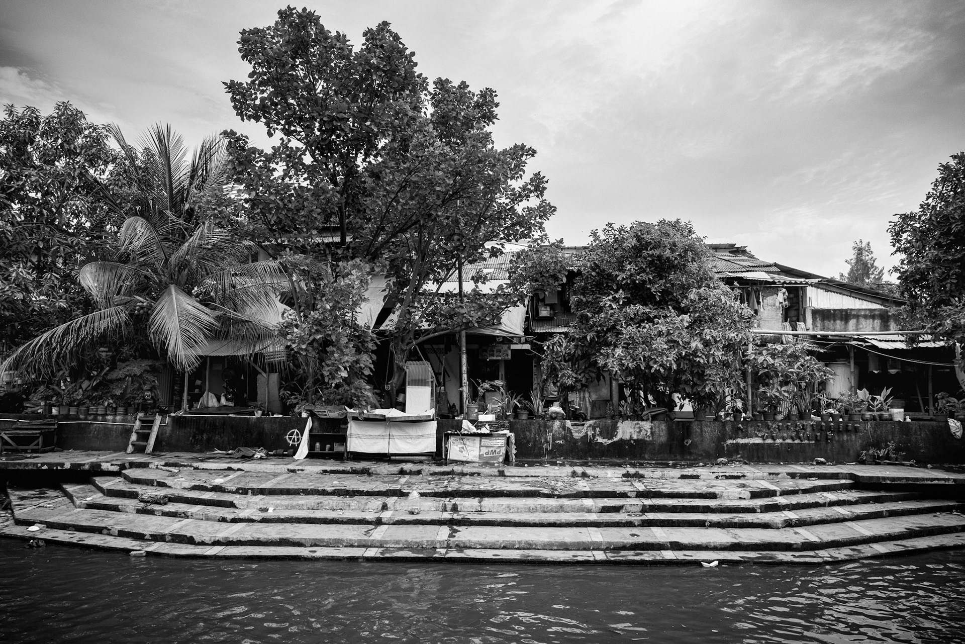 A community at the water's threshold: Constant maintenance is the price of living at sea level. Muara Baru, Jakarta, January 2026