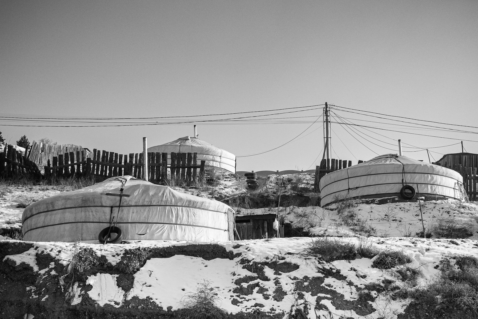 Gers and small wooden houses packed together without running water or sewage systems. Khoroo 43 Ger district, Ulan Baator, Mongolia, December 2025