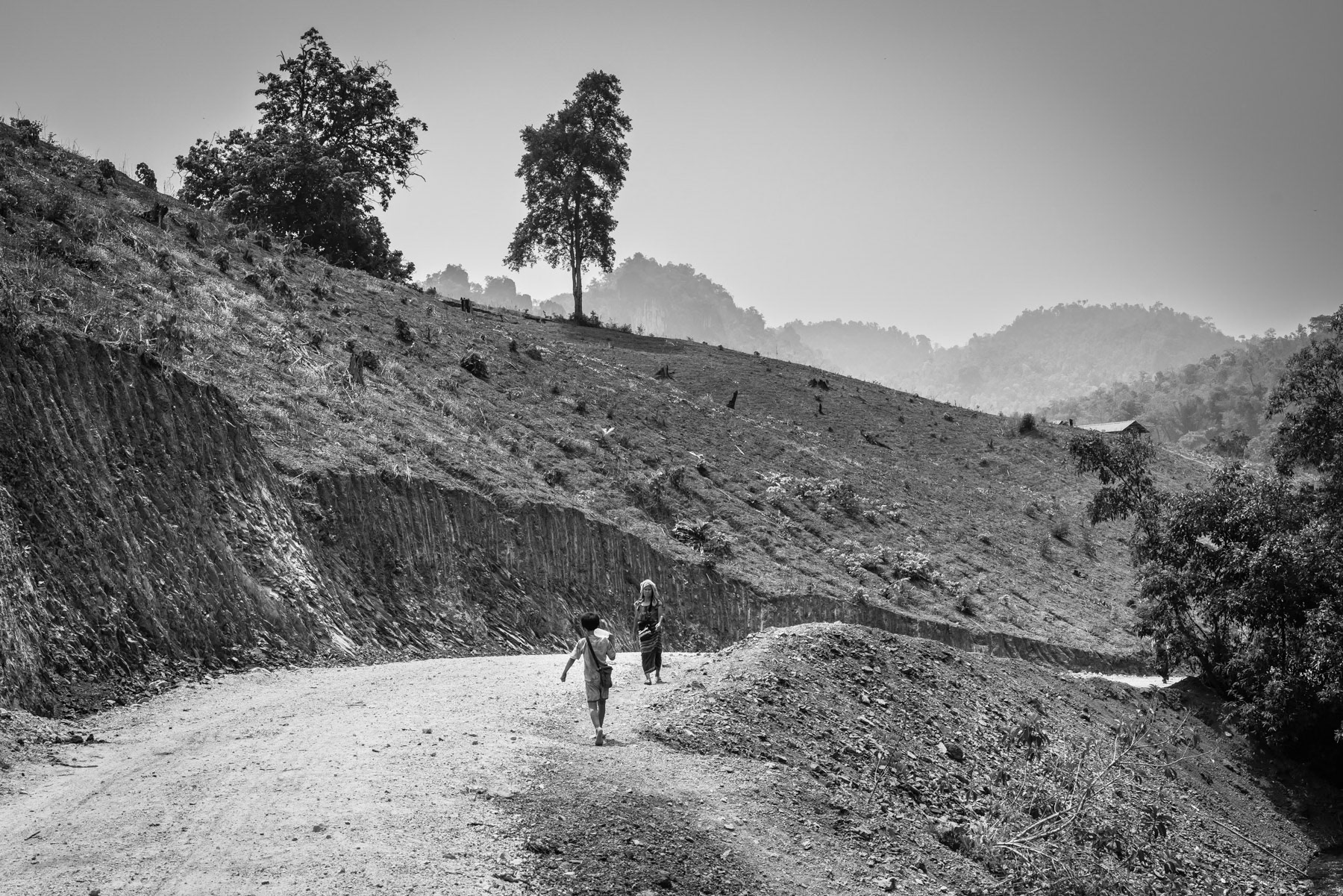 Returning with water to the Htaw Internal Displaced Camp. Kanele, Kayin State in Myanmar, May 2024