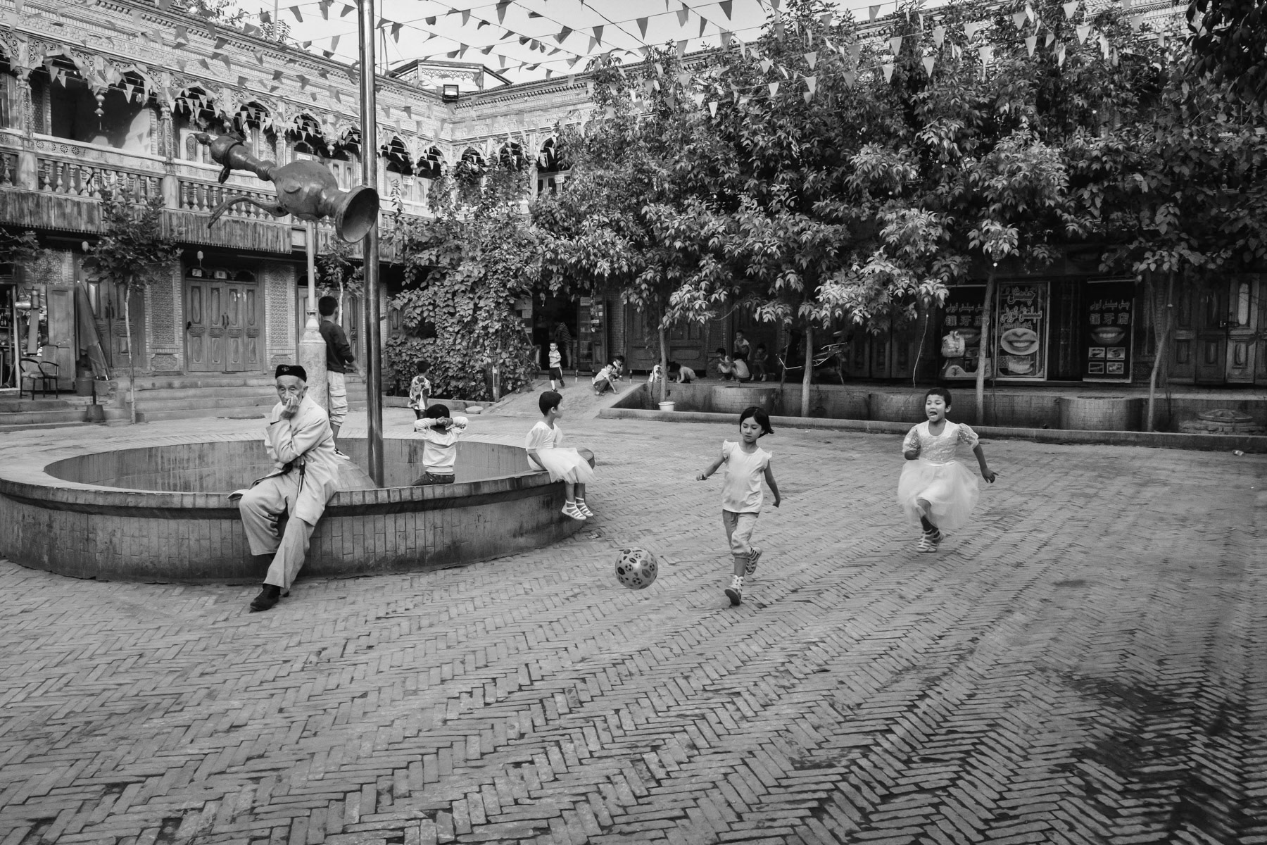 The "new" old town of Kashgar. The old town was completely renovated and rebuilt, many neighbourhoods got razed and replaced by new housing projects keeping the look of the old town architecture. Kashgar has a large majority of Uyghur residents. Xinjiang, China, September 2019