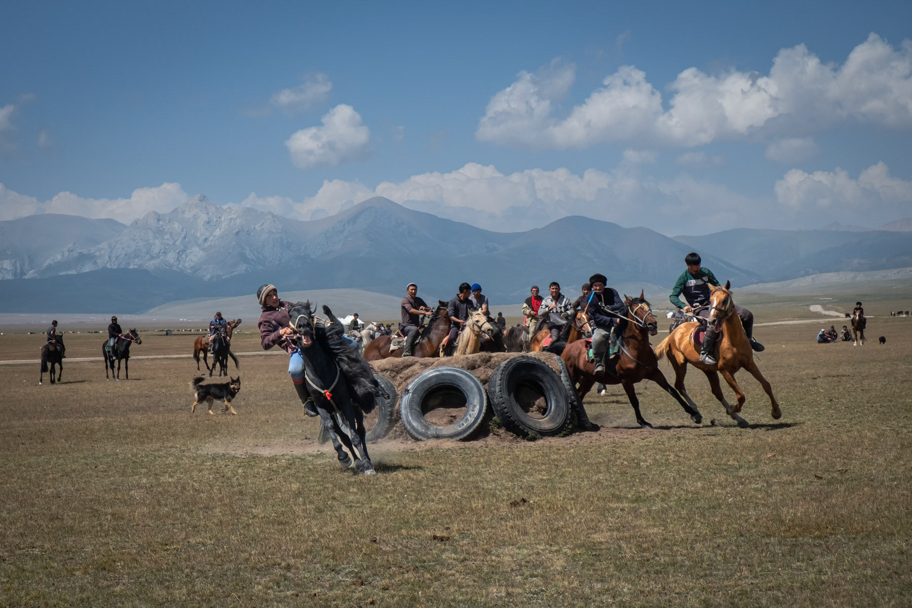 Kok Boru horseback game, Kok Boru is a traditional horseback game consisting of dropping a dead goat carcass in the opponents' goal. In Kyrgyzstan and generally Central Asia and Afghanistan it is considered a national sport and very popular. Son Kul Lake, Naryn region, Kyrgyzstan, August 2021