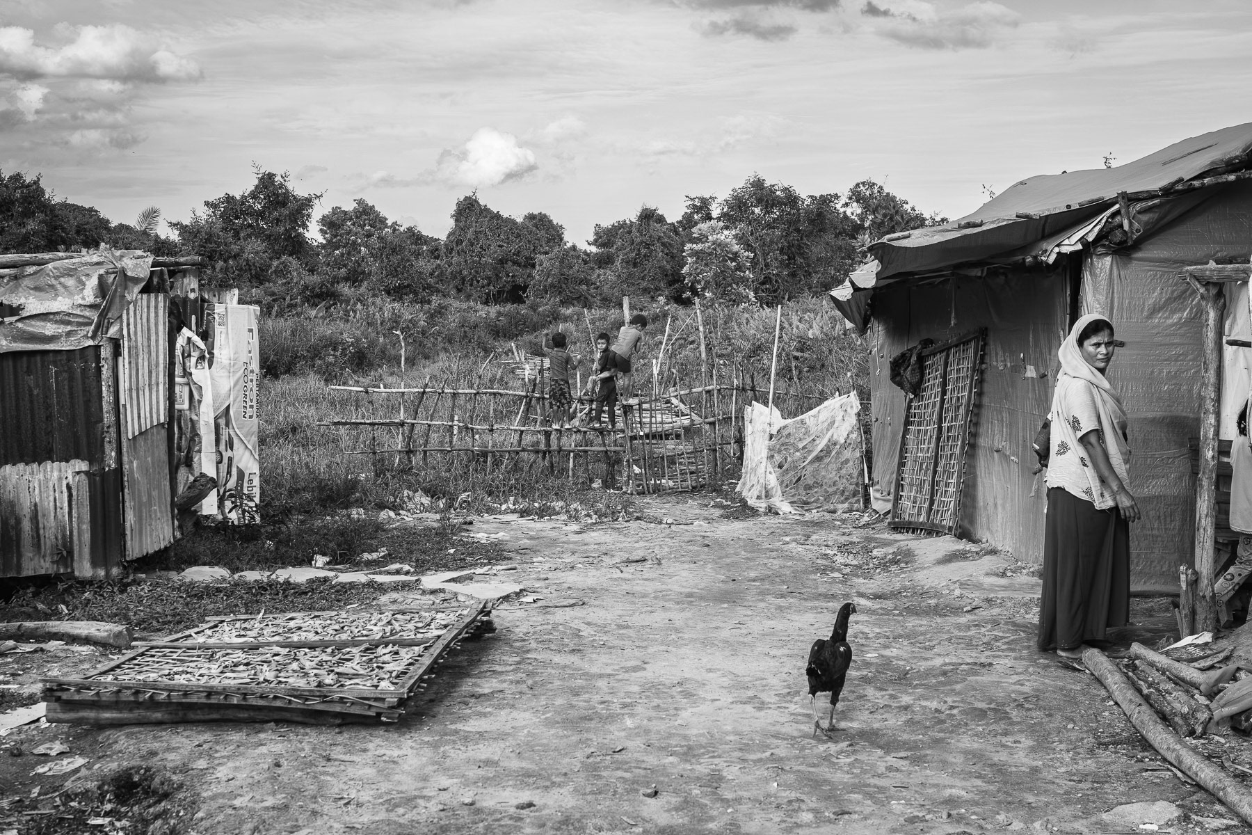 Etched with quiet strength, a Rohingya refugee's journey continues in a makeshift camp, months after a treacherous boat journey. Pekanbaru, Indonesia, May 2025