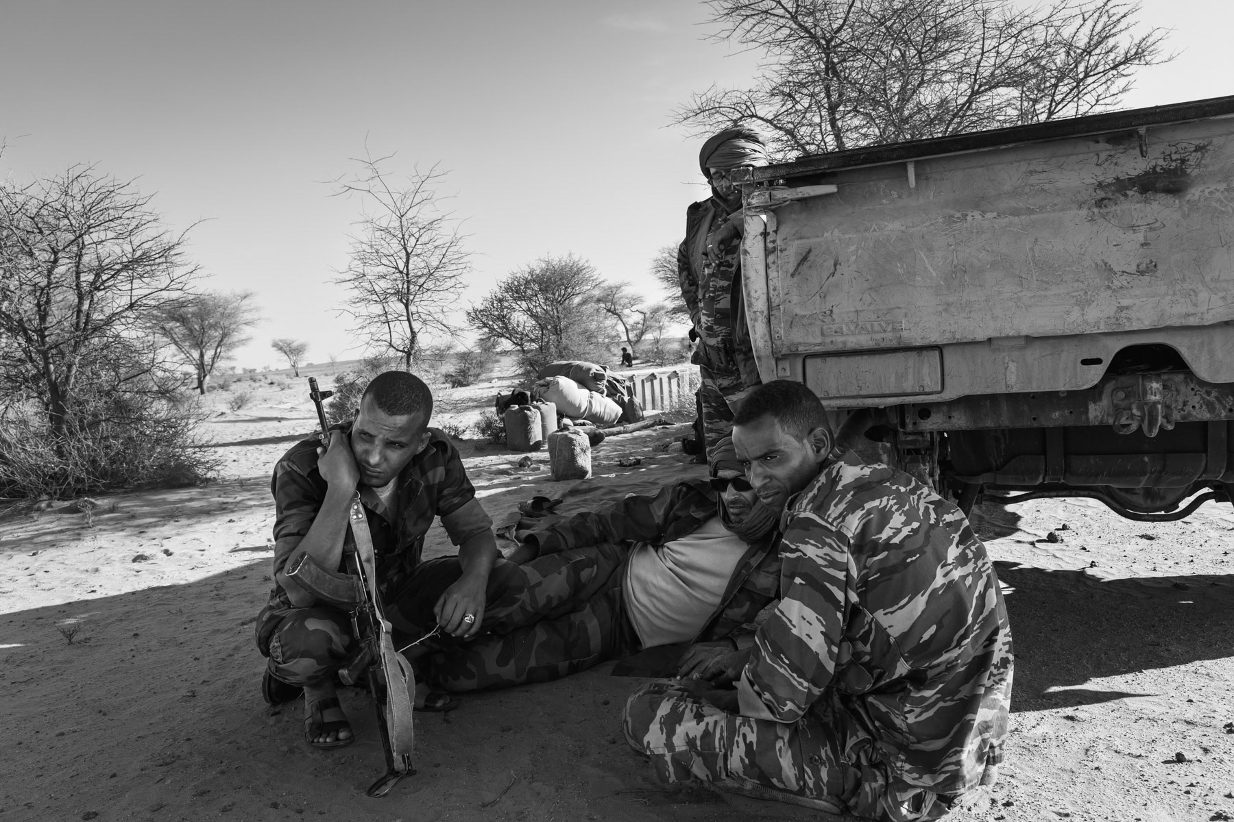 Members of a Sahrawi military unit having a rest at their base camp at an undisclosed location in the Western Sahara desert. Second military region, Sahrawi Arab Democratic Republic, October 2021