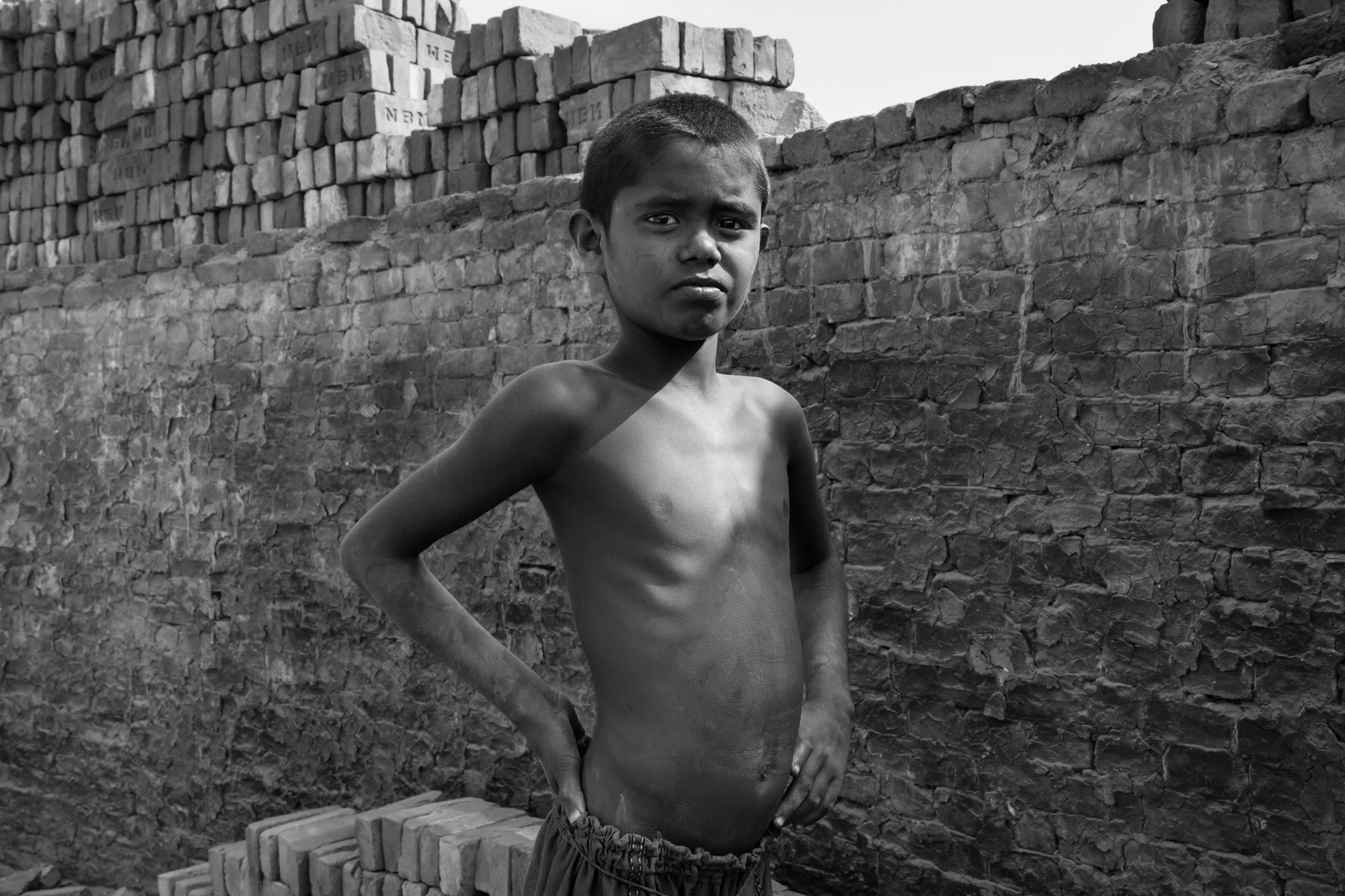 The majority of the brick kiln workforce are internal migrants from rural areas moving to Dhaka during the brick production season from December to May. Often entire families migrate when they can live around the brick fields and provide work for all including young children. Bangladesh, May 2015