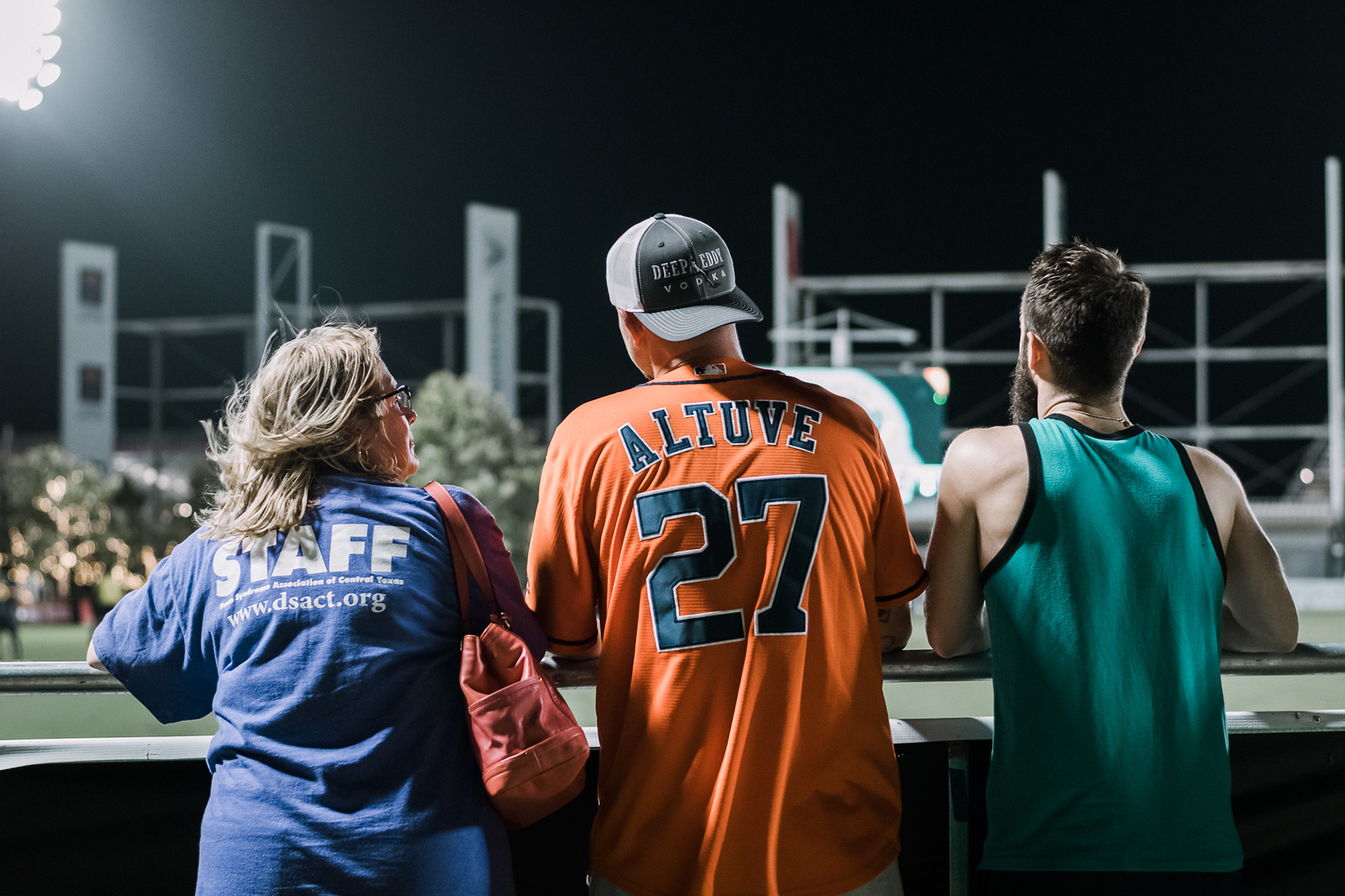 Family and friends chat as they watch a soccer game at the Austin Aztecs' field.