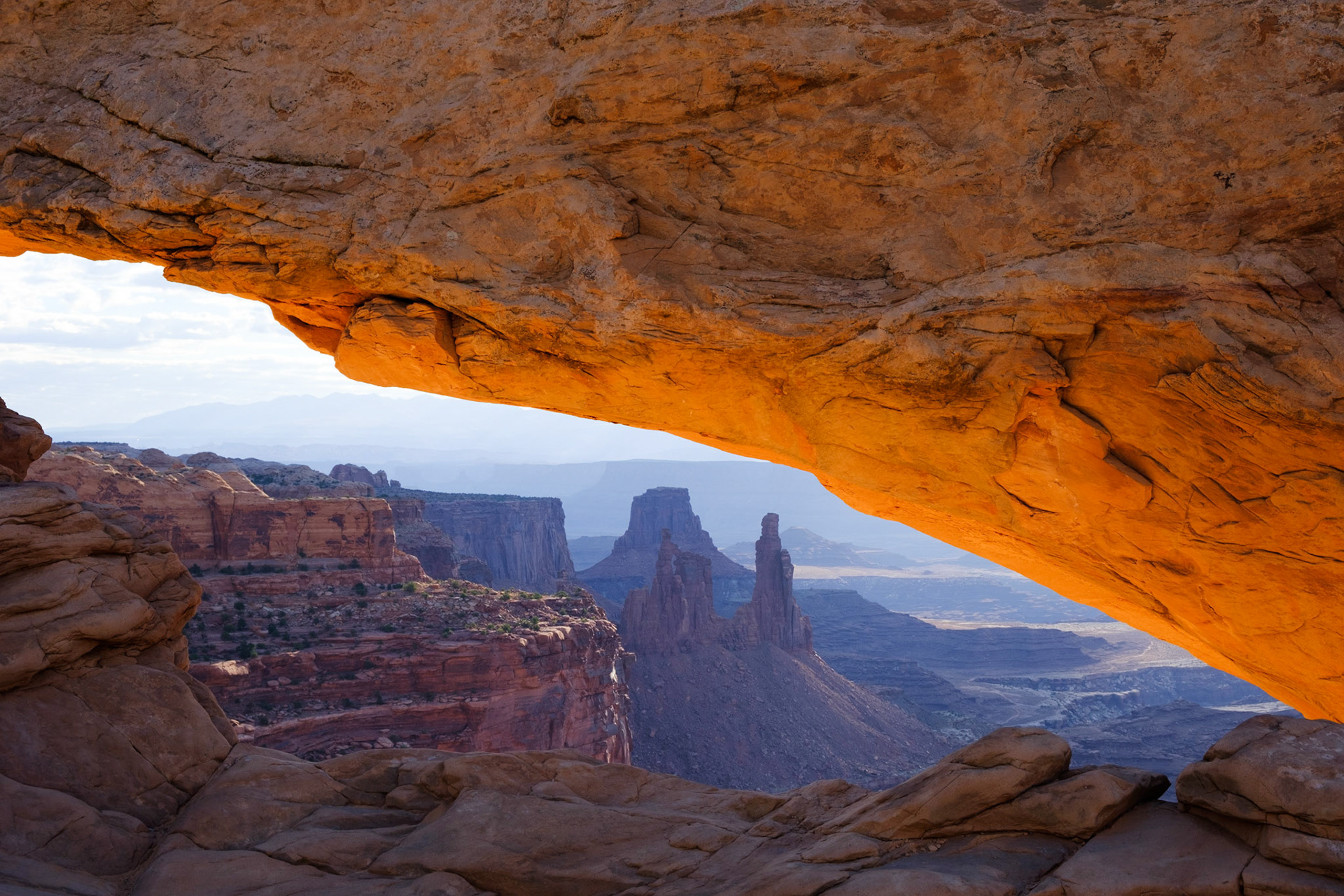 Sun catching the underside of Mesa Arch early in the morning, Canyonlands